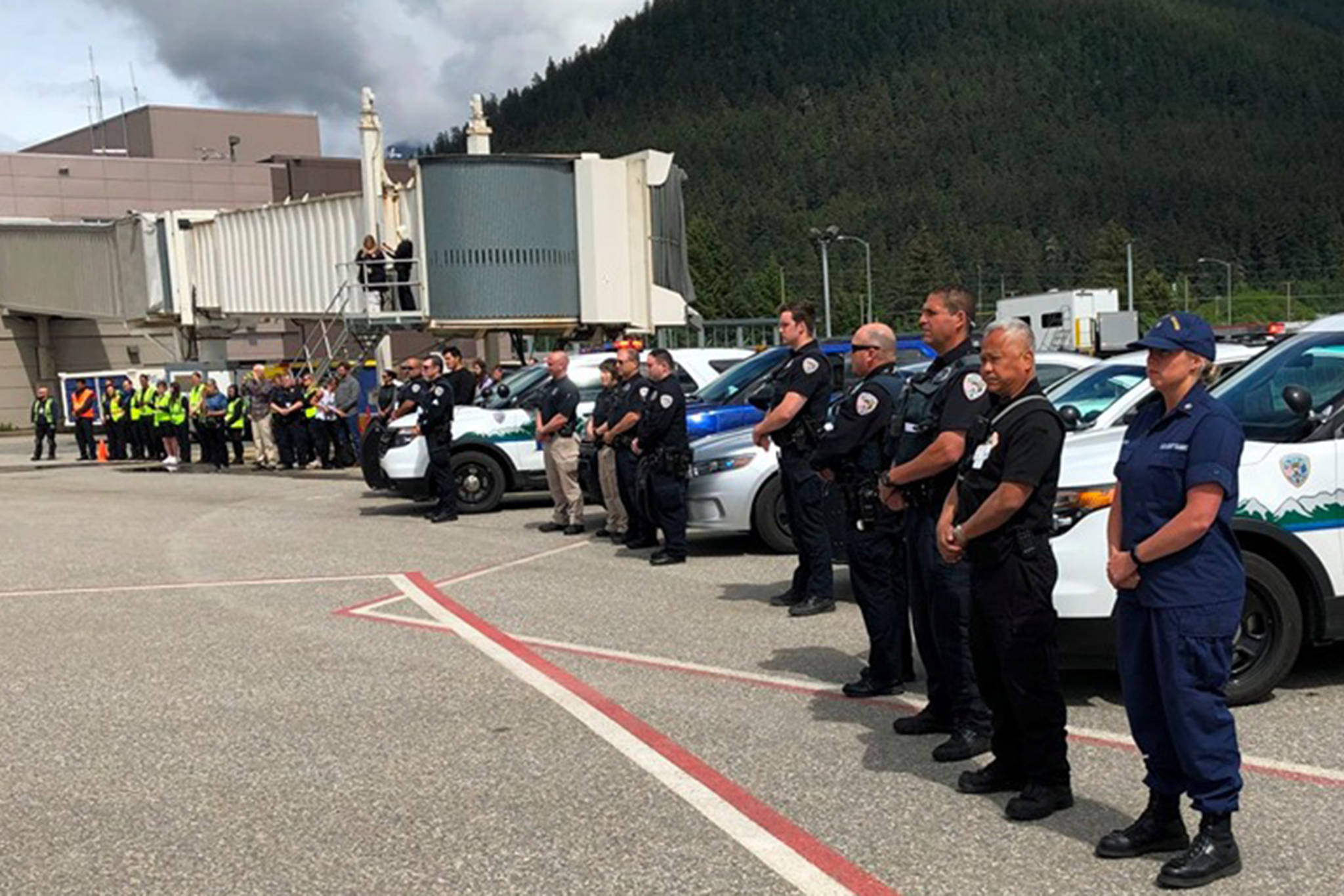 Emergency personnel pay their respects to Juneau man Bill Dean, an Army veteran who died in late May during a rockslide on Mount Rainier. (Courtesy photo | Marc Cheatham, Juneau International Airport)