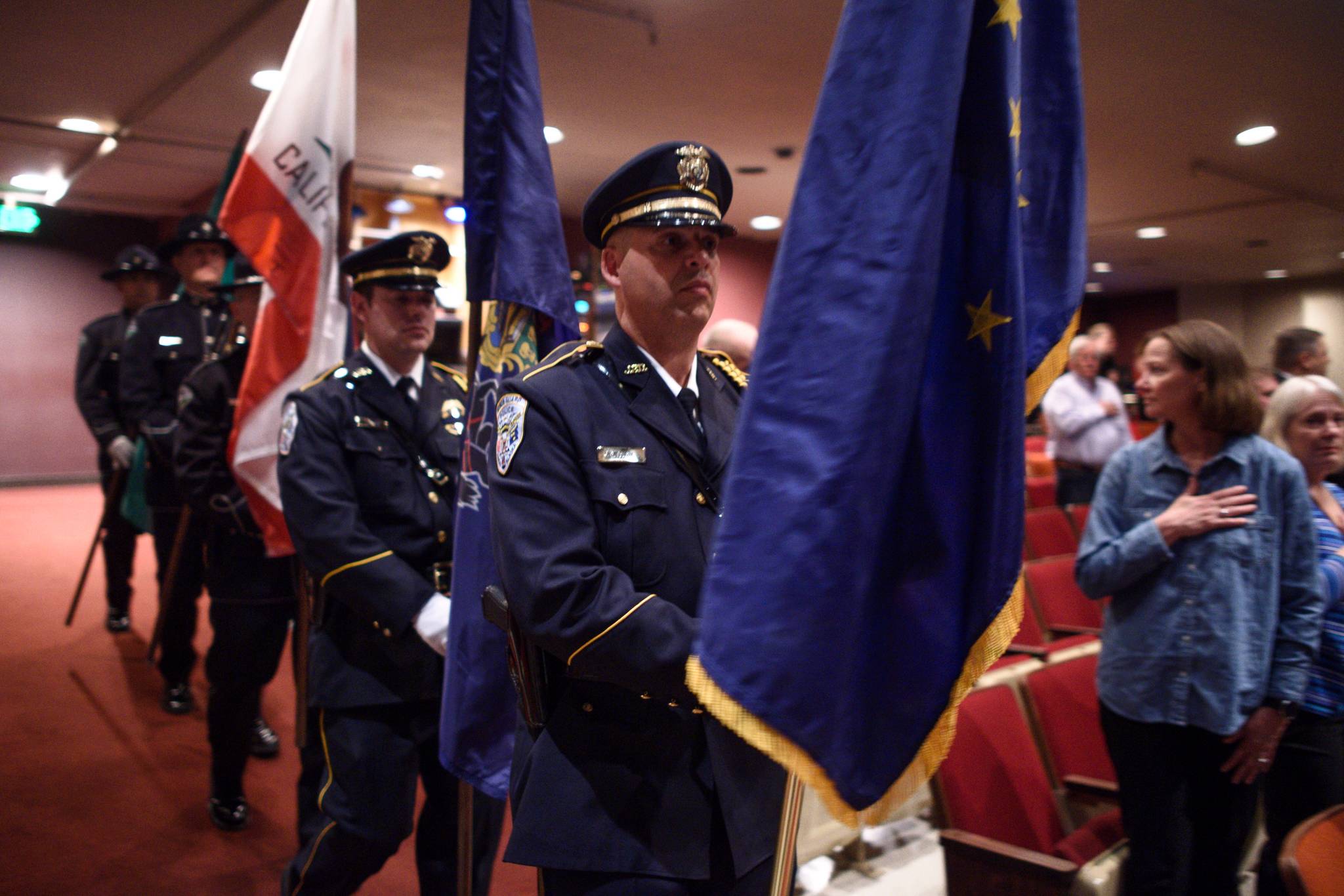 A first responders Honor Guard enter the auditorium for the Guardian memorial at Juneau-Douglas High School: Yadaa.at Kalé on Friday, June 7, 2019. (Michael Penn | Juneau Empire)