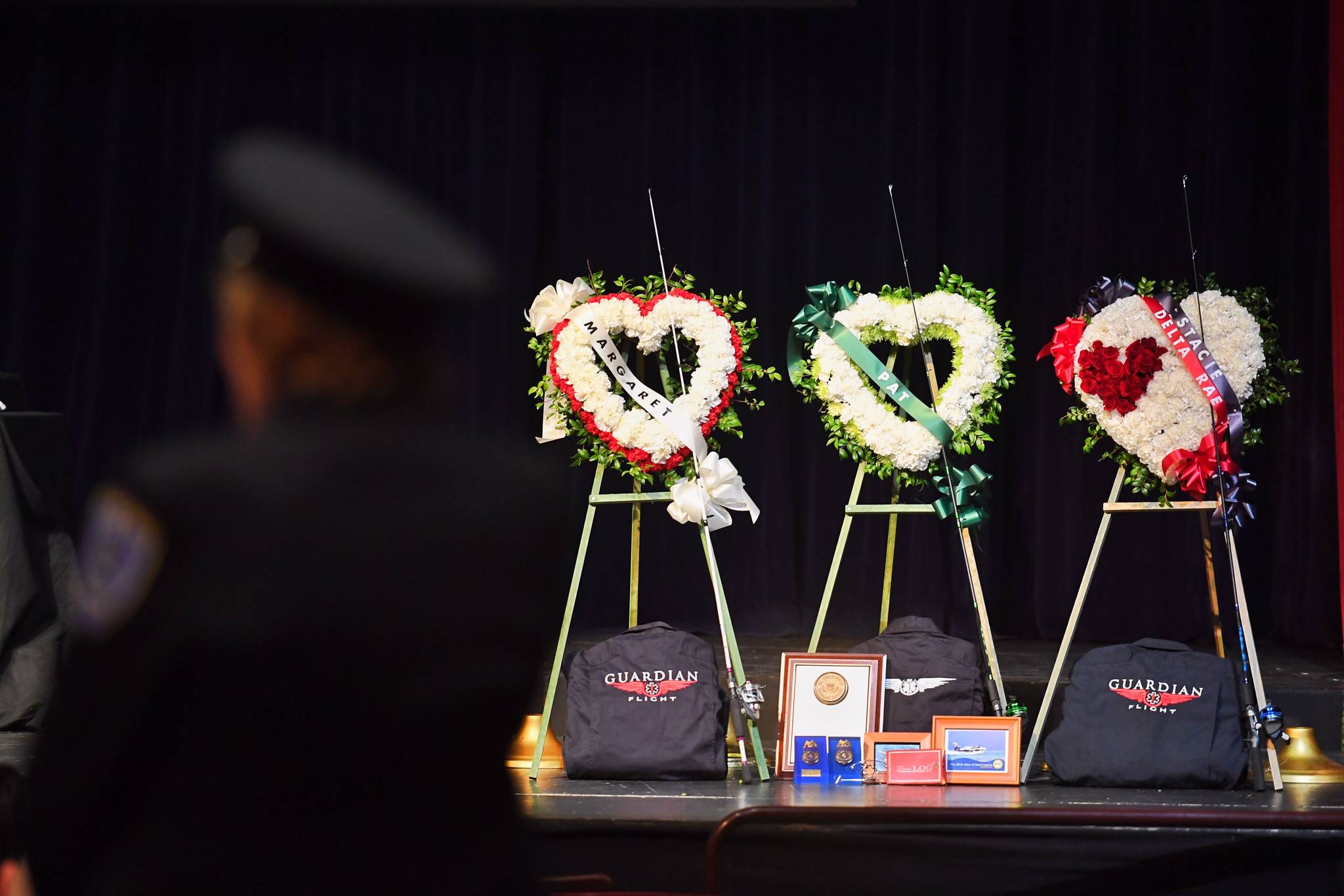 Memorial hearts are pictured on stage during the Guardian memorial at Juneau-Douglas High School: Yadaa.at Kalé on Friday, June 7, 2019. (Michael Penn | Juneau Empire)