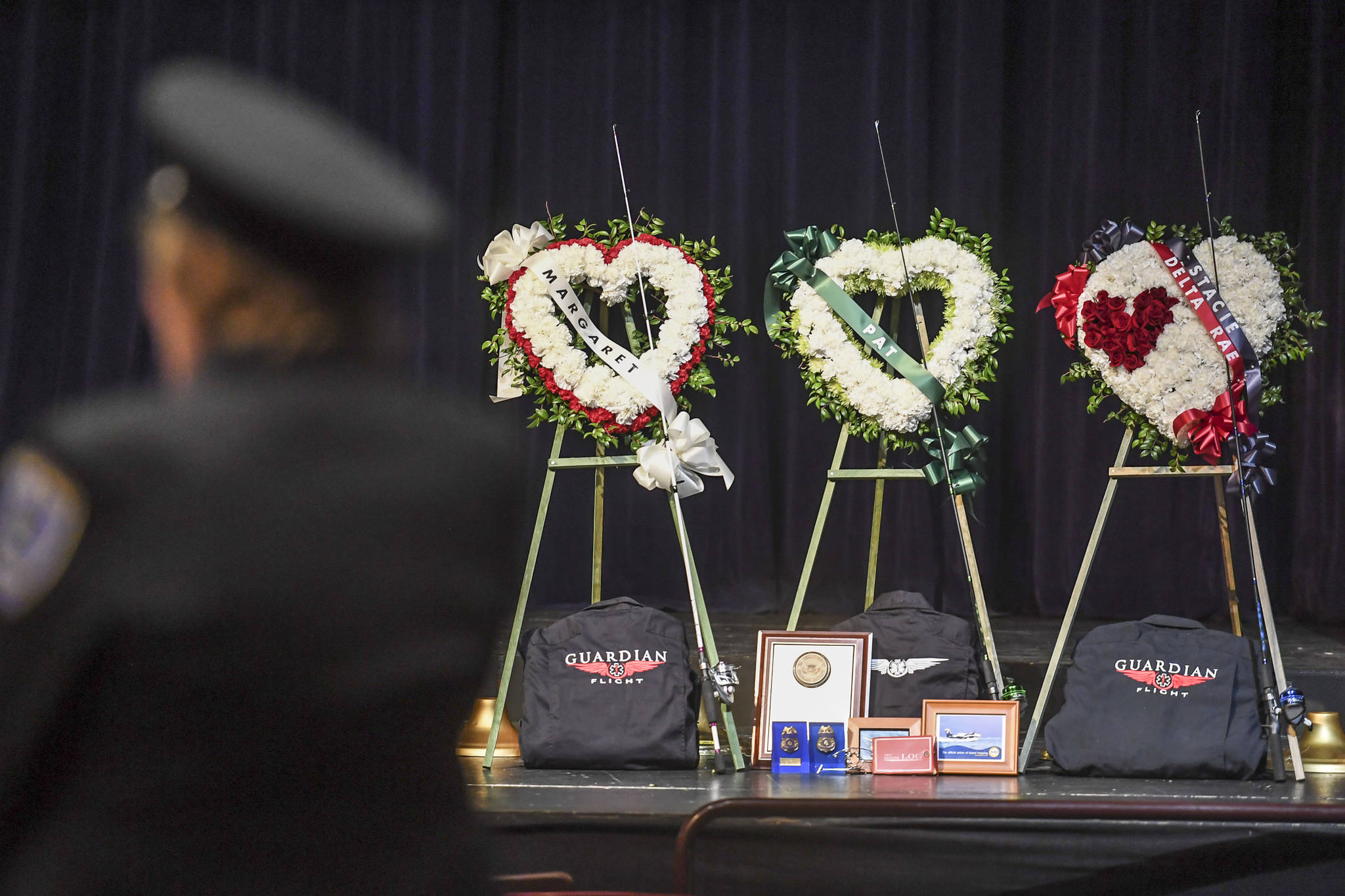 The memorial service for the Guardian Flight crew is held at Juneau-Douglas High School: Yadaa.at Kalé on Friday, June 7, 2019. (Michael Penn | Juneau Empire)