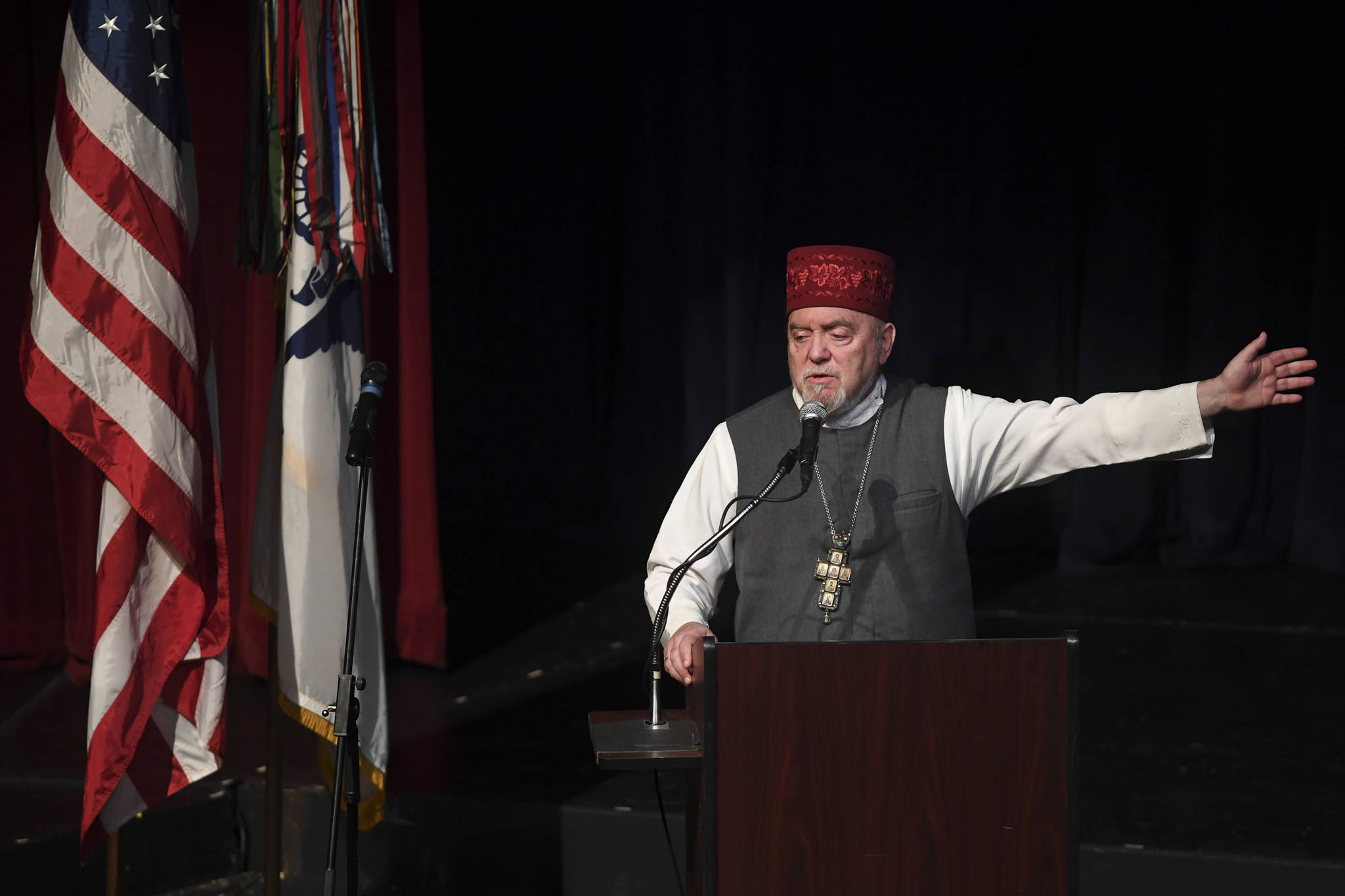 Father Michael Oleksa speaks during the memorial service for the Guardian Flight crew held at Juneau-Douglas High School: Yadaa.at Kalé on Friday, June 7, 2019. (Michael Penn | Juneau Empire)