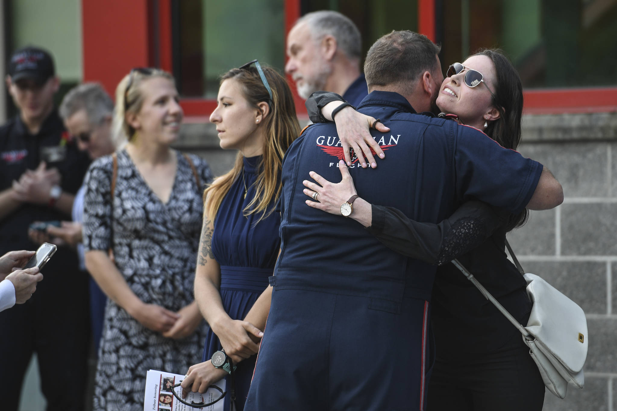 The memorial service for the Guardian Flight crew is held at Juneau-Douglas High School: Yadaa.at Kalé on Friday, June 7, 2019. (Michael Penn | Juneau Empire)