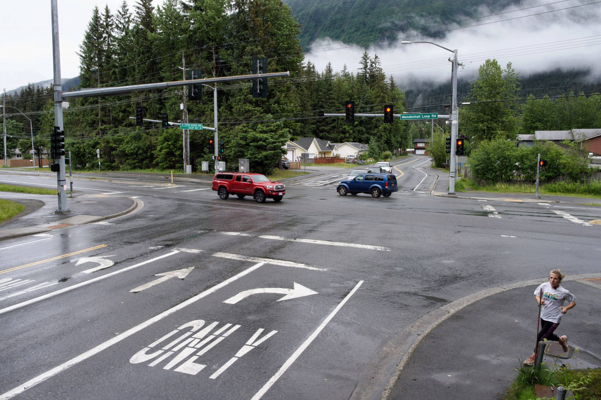 The intersection of Stephen Richards Memorial Drive and Mendenhall Loop Road on Wednesday, June 11, 2019. The Department of Transportation and Public Facilities plans to build a roundabout at the intersection. (Michael Penn | Juneau Empire)