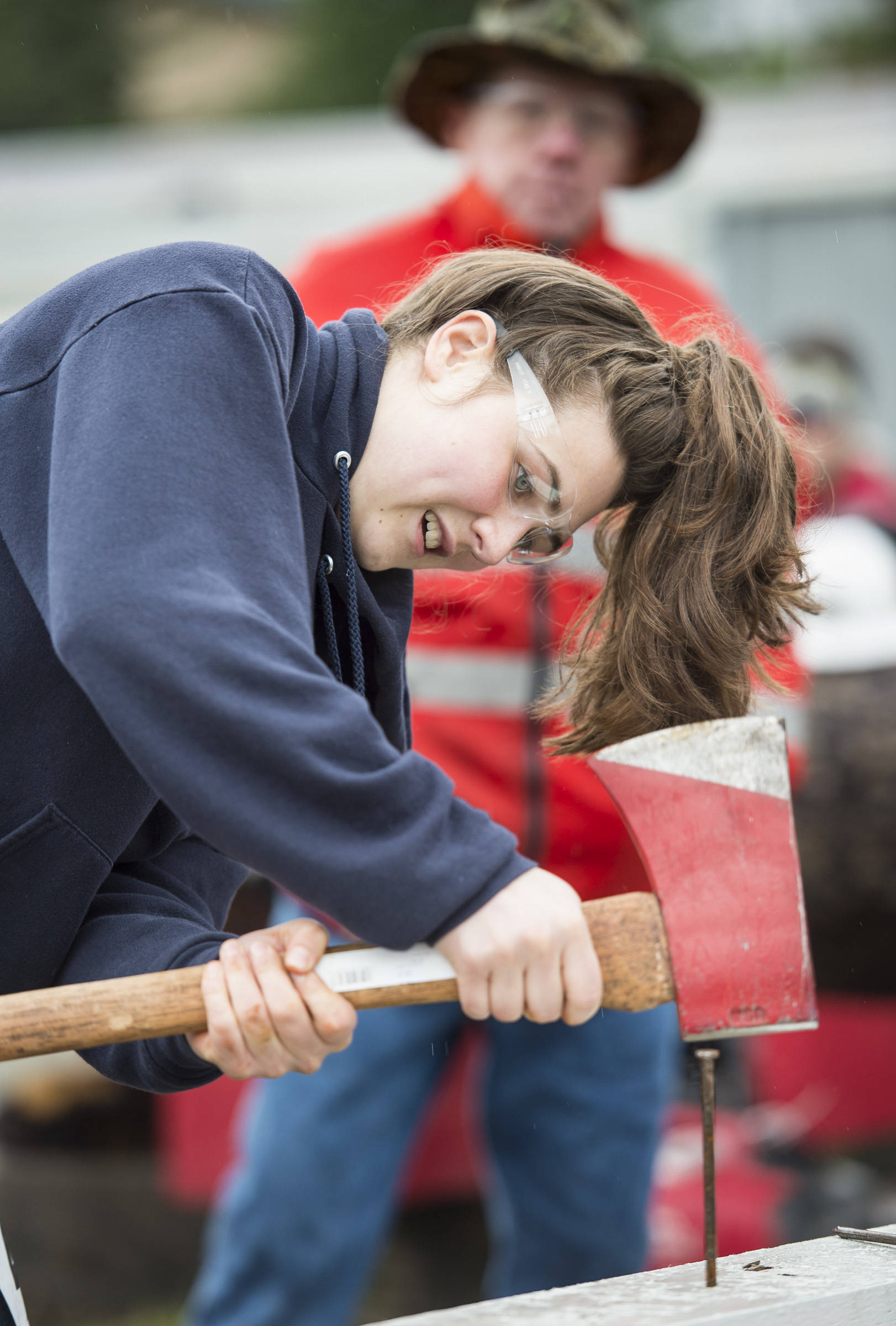 Abigail Hoy competes in the women’s spike driving contest during the 27th annual Juneau Gold Rush Days at Savikko Park. (Michael Penn | Juneau Empire File)