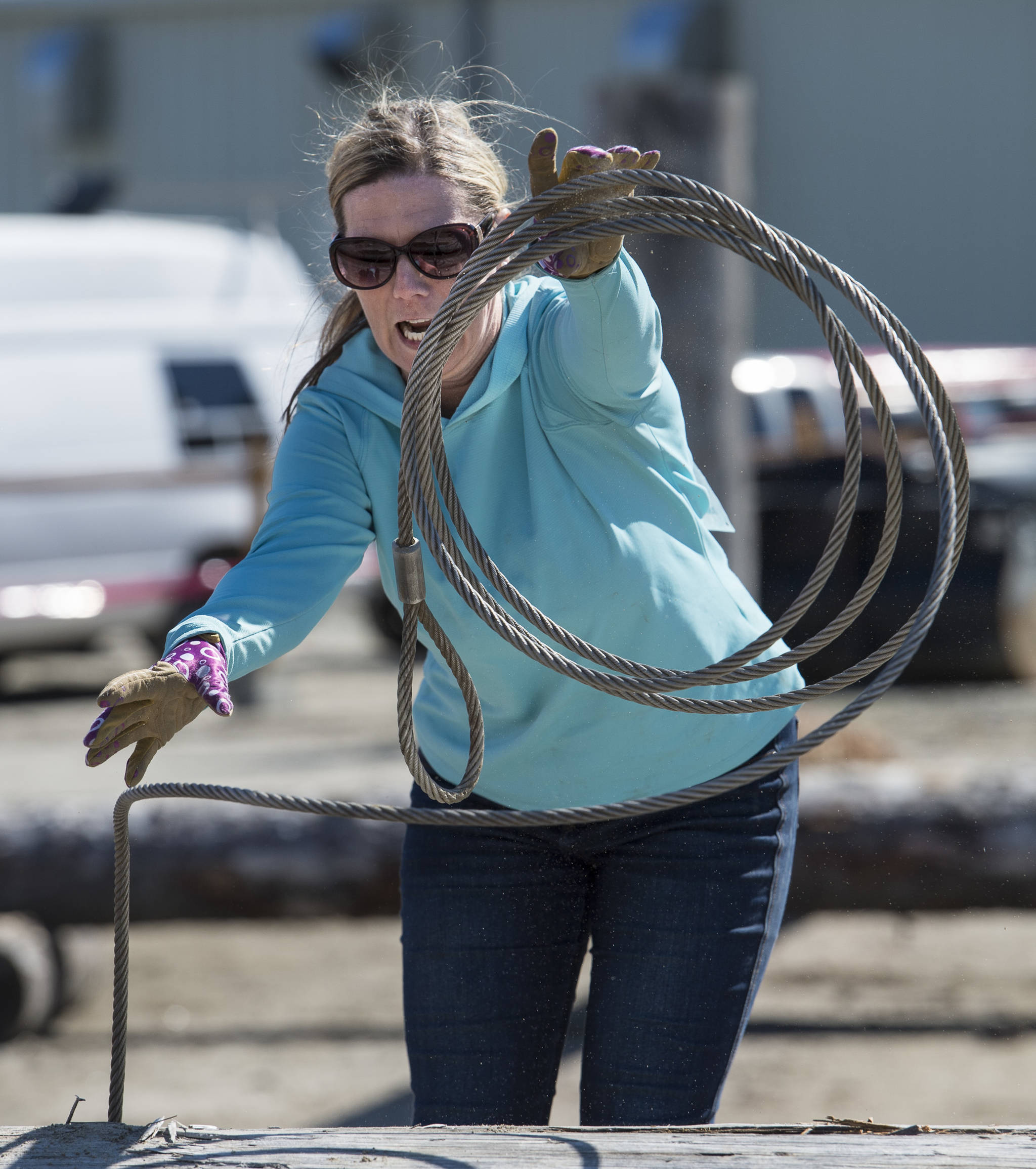 April Hoy throws cable over a log during the women’s choker setter contest at the 27th Annual Gold Rush Days at Savikko Park. (Michael Penn | Juneau Empire File)