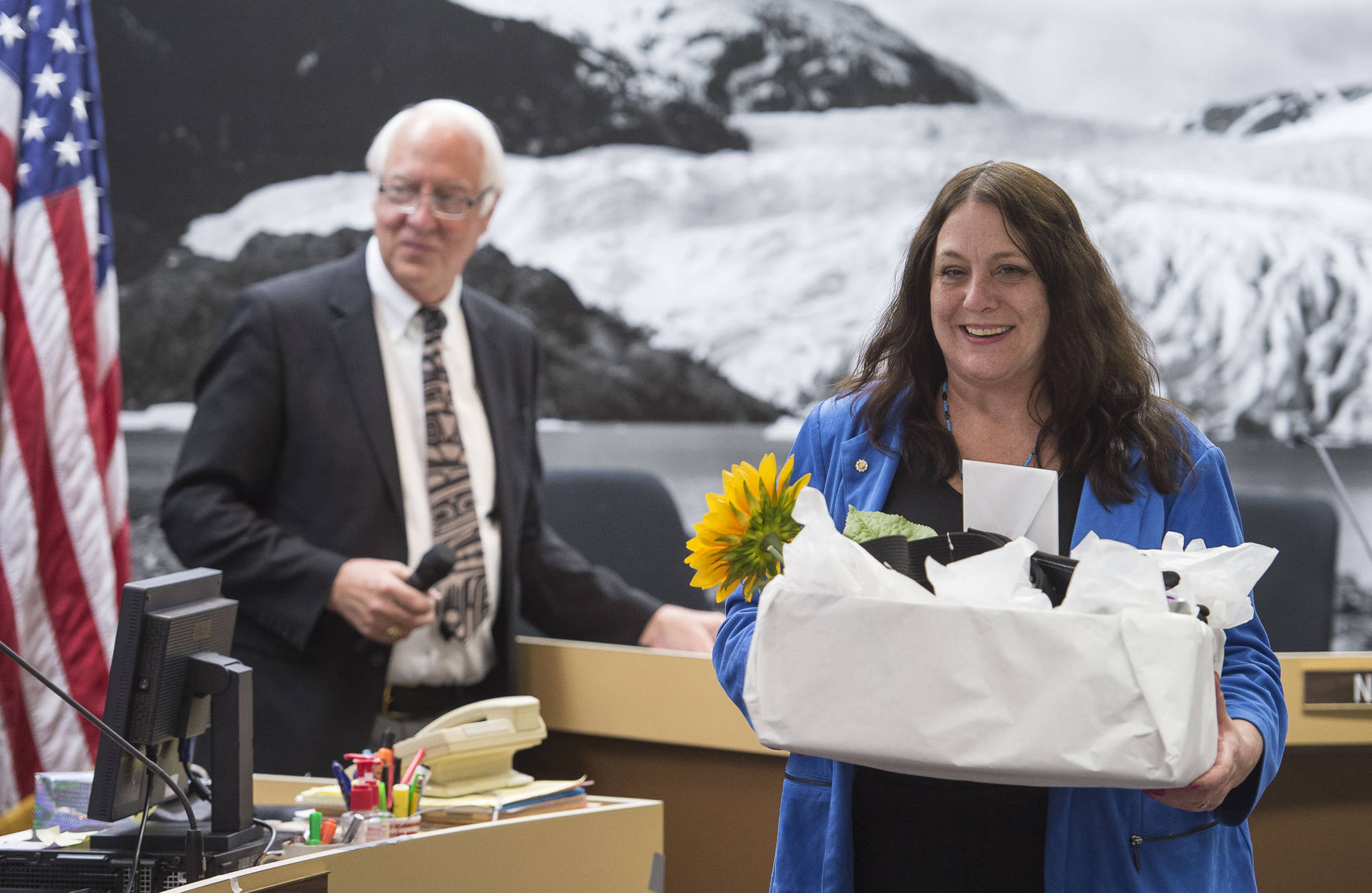 Former Assembly member Debbie White leaves the Assembly chambers after being acknowledged for her service on the Assembly and many city committees at the start of the Assembly meeting on Monday, Oct. 16, 2017. (Michael Penn | Juneau Empire File)
