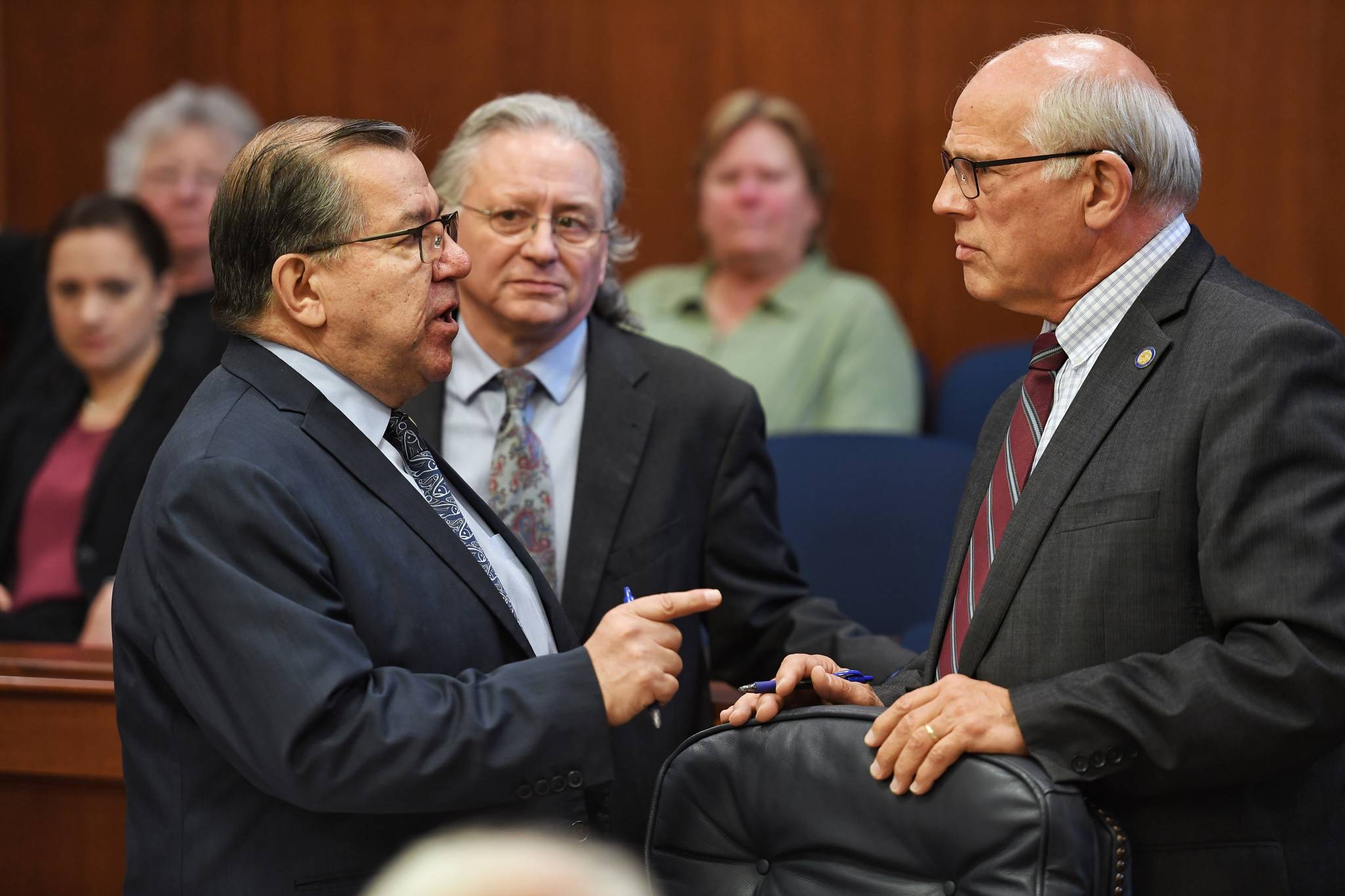 Sen. Lyman Hoffman, D-Bethel, left, expressed his displeasure with Sen. John Coghill, R-North Pole, right, as Sen. Tom Begich listens, during debate on the capital budget in the Senate at the Capitol on Thursday , June 13, 2019. (Michael Penn | Juneau Empire)