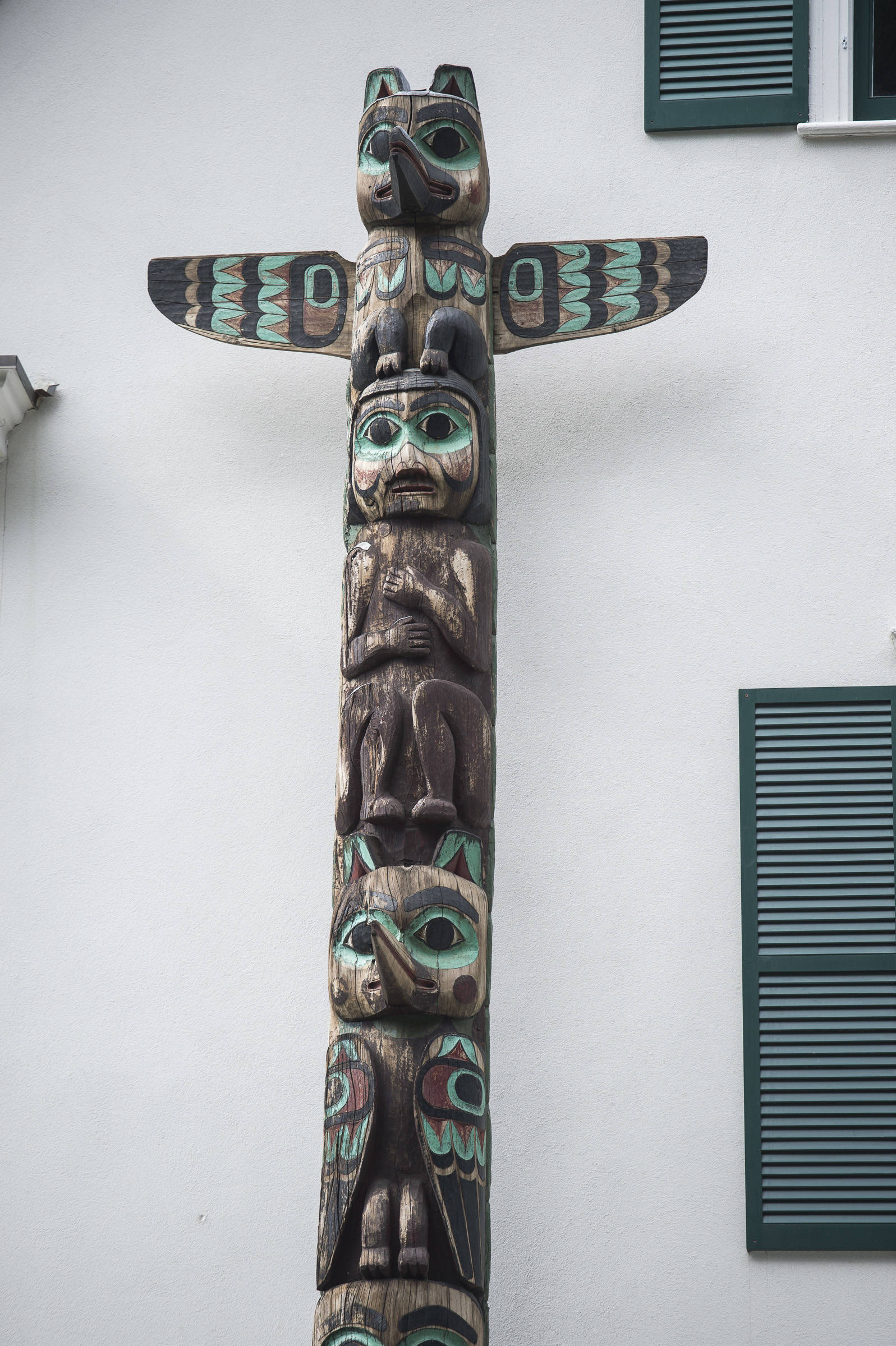 The totem at the Governor’s House is an example of totems carved by people employed by the Civilian Conservation Corps. (Michael Penn | Juneau Empire)
