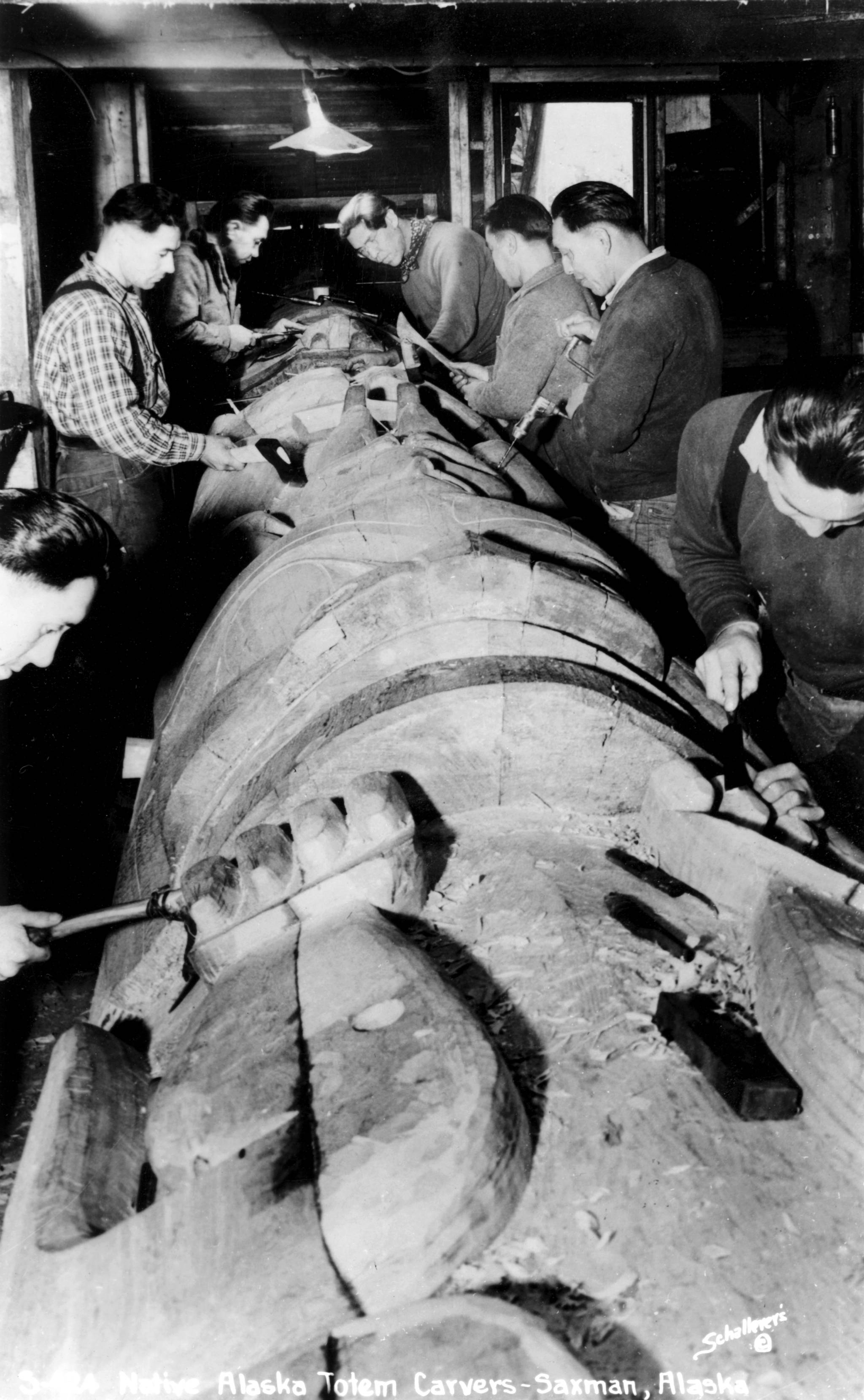 Civilian Conservation Corps carvers in Saxman restore the “Chief Ebbits Pole” from Tongass Village, 1940. (Courtesy Photo | Tongass Historical Museum)