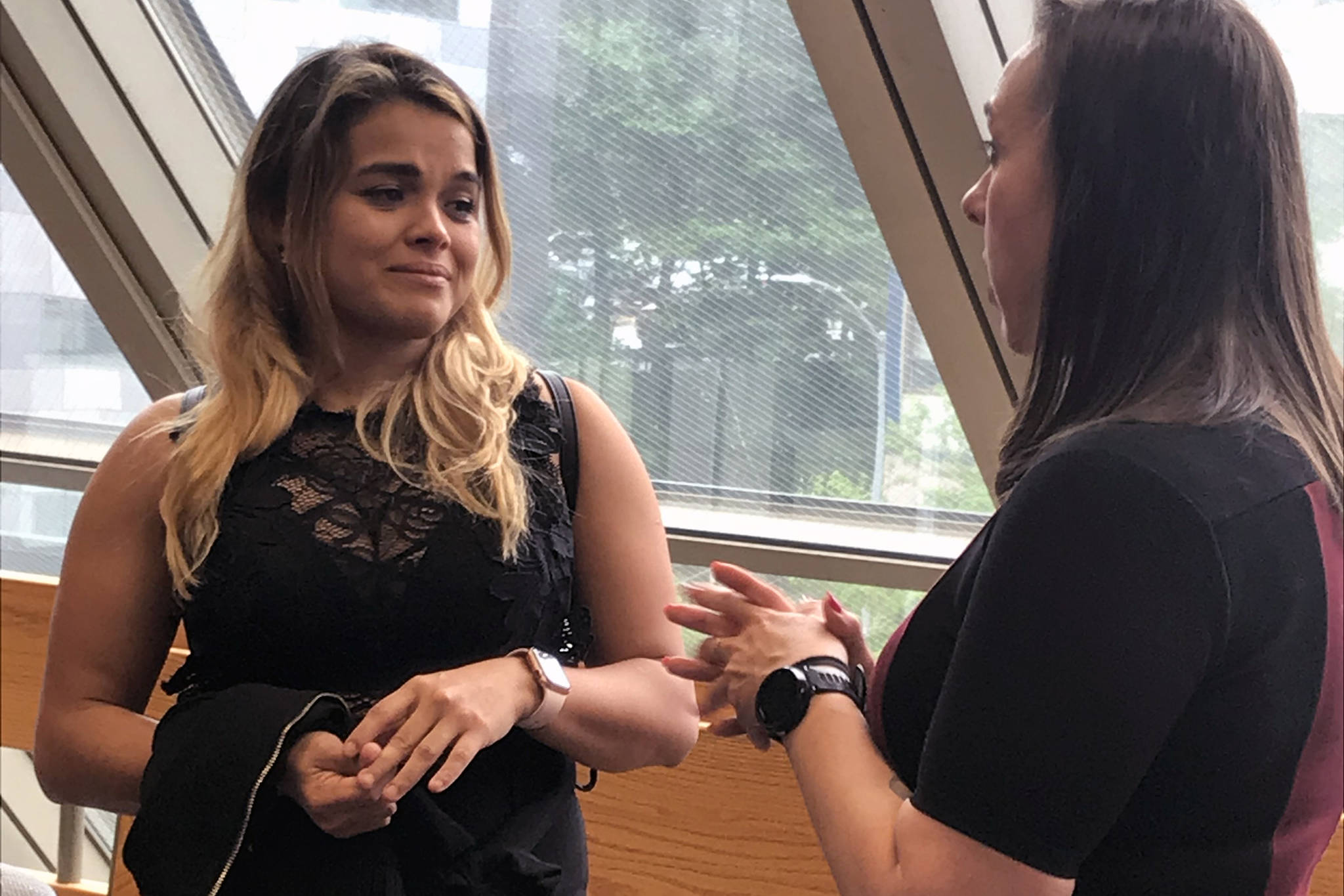 Widow Maria Gonzalez, left, speaks with Assistant District Attorney Amy Paige on Monday, June 17, 2019. (Alex McCarthy | Juneau Empire)