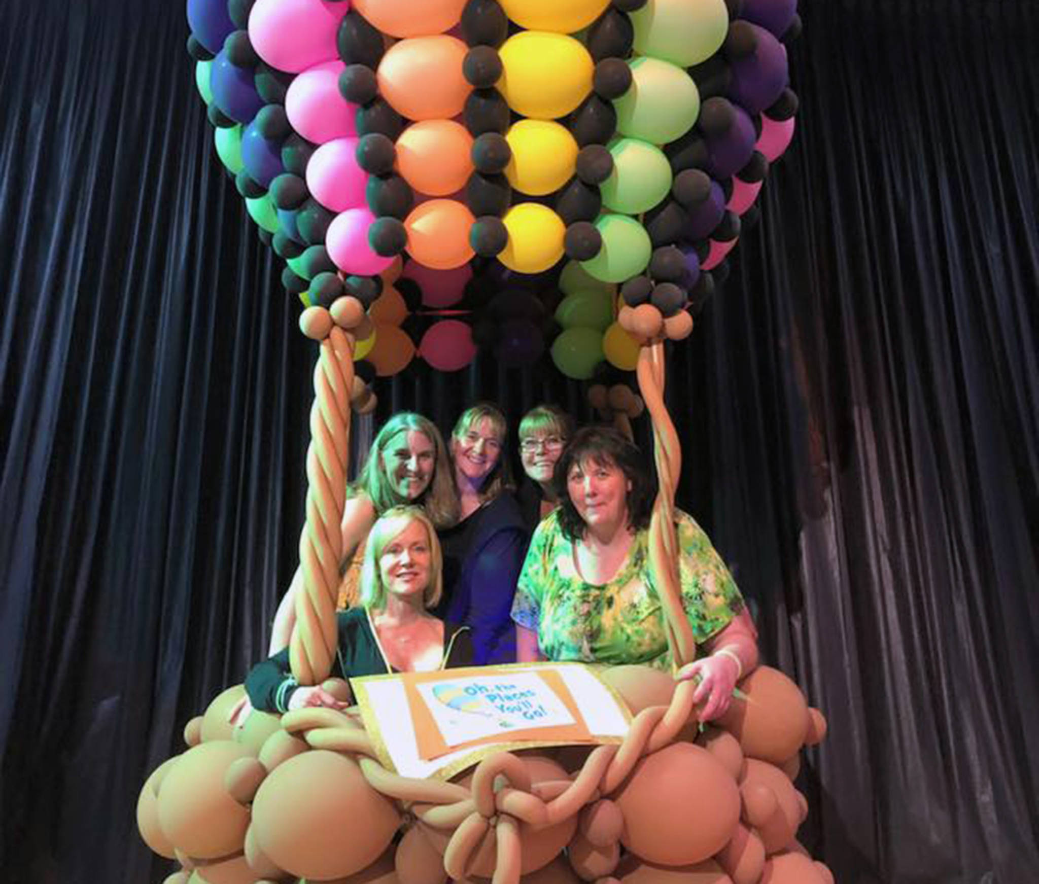 The 2019 Safe Grad Prize Committee takes a break for a picture in the Oh, the places you will go! hot air balloon, created by Balloons by Night Moods. (Courtesy photo)