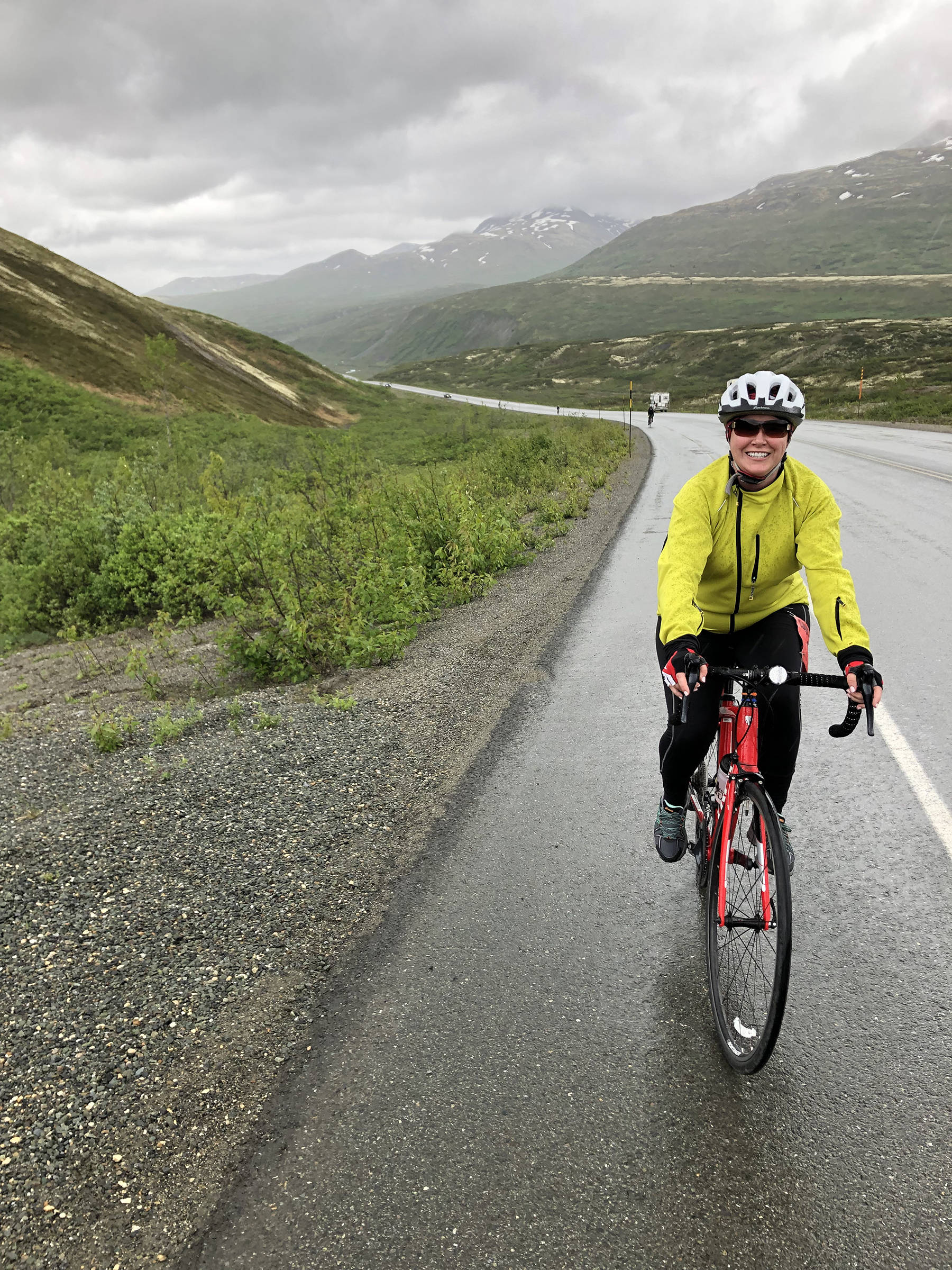Amber Falcon of Juneau tries to stay dry on Leg 6 of the Kluane Chilkat International Bike Relay on Saturday, June 15, 2019. Falcon, a teacher with the Juneau School District, teamed up with Ivan Falcon and Dave Ringle to form the three-person team, “Two Falcons and a Wolverine.” The team of three finished the 148-mile relay in just under 13 hours. (Courtesy Photo | Dave Ringle)