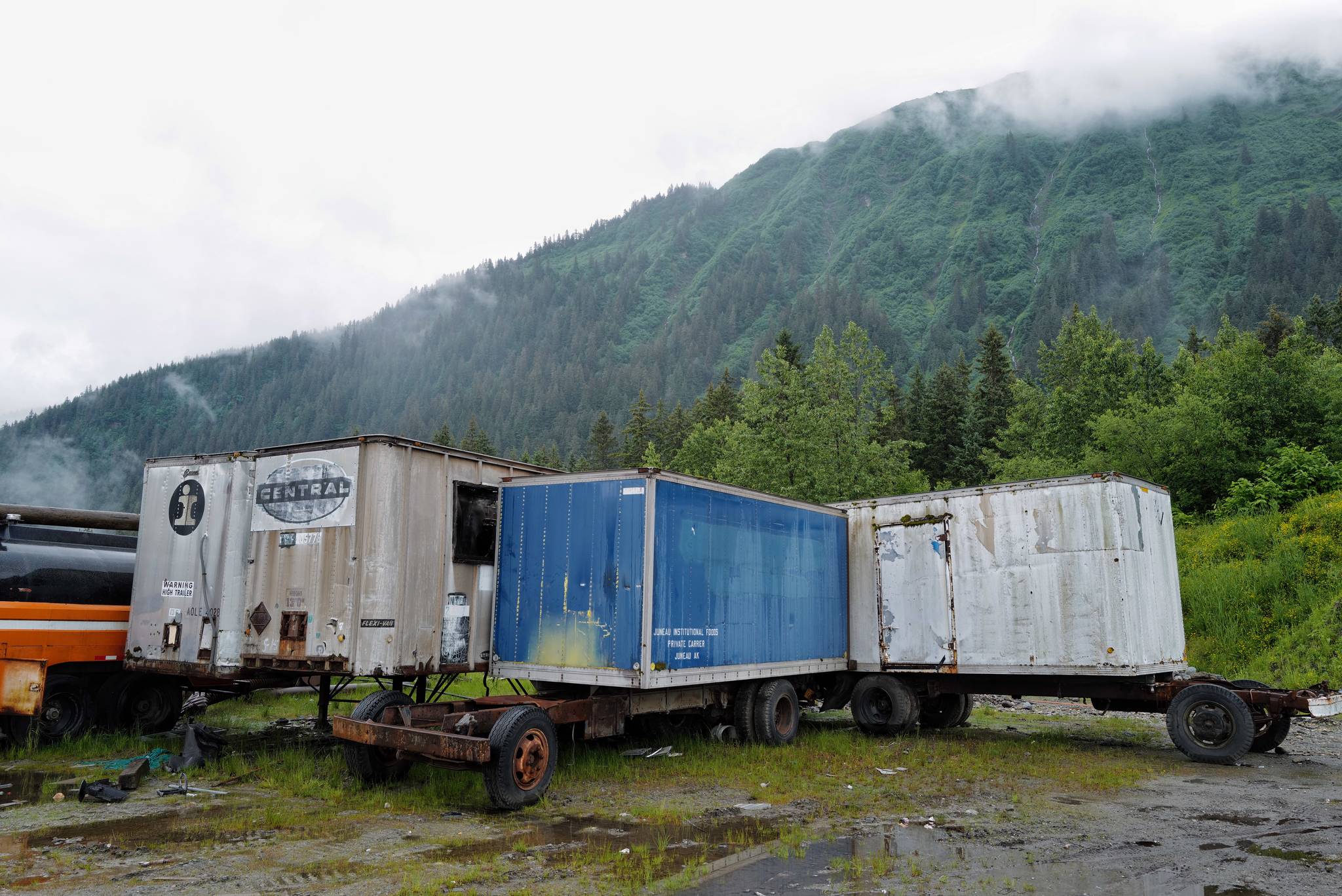 Shipping containers are pictured in a lot on Valley Boulevard on Tuesday, June 18, 2019. Capital City Fire/Rescue responded to fire set in two of the containers on Monday. (Michael Penn | Juneau Empire)