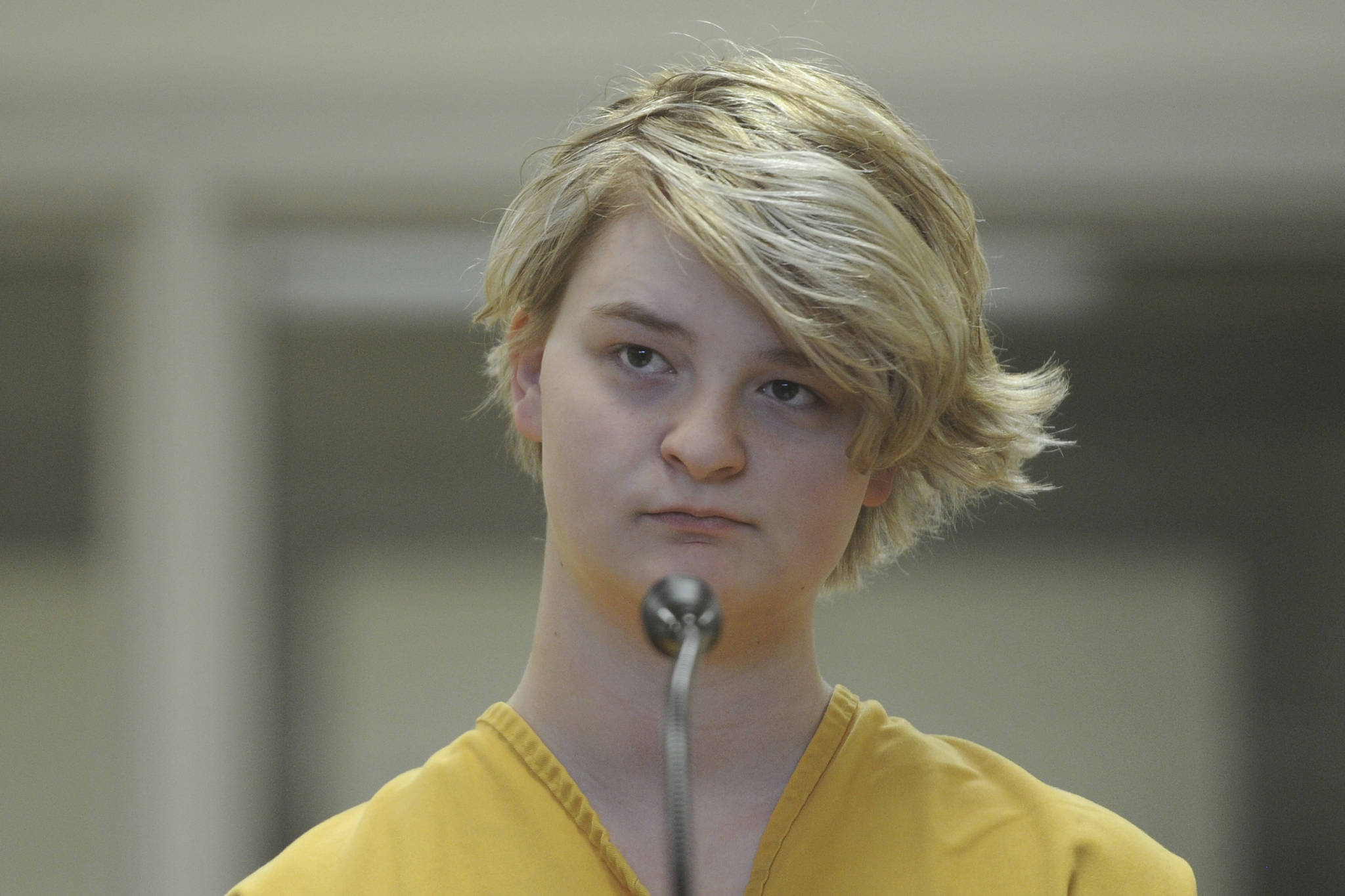In this Sunday, June 9, 2019 photo, Denali Brehmer, 18, stands at her arraignment in the Anchorage Correctional Center in Anchorage. Brehmer has been charged with first-degree murder in the death of Cynthia Hoffman. (Bill Roth/Anchorage Daily News via AP)