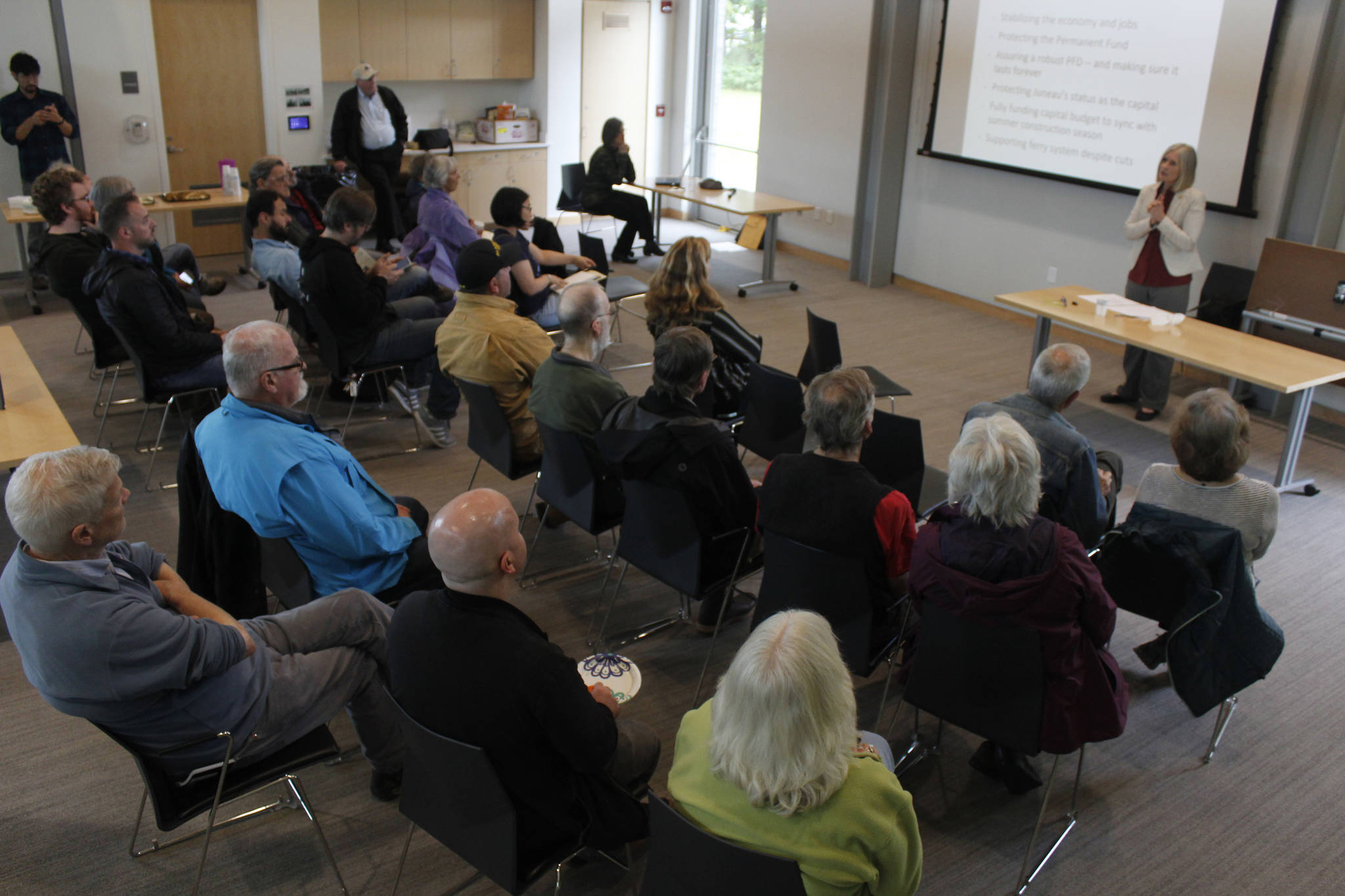 Rep. Andi Story, D-Juneau, addresses a crowd of attendees at a town hall meeting at the Mendenhall Valley Public Library on Wednesday, June 19, 2019. (Alex McCarthy | Juneau Empire)