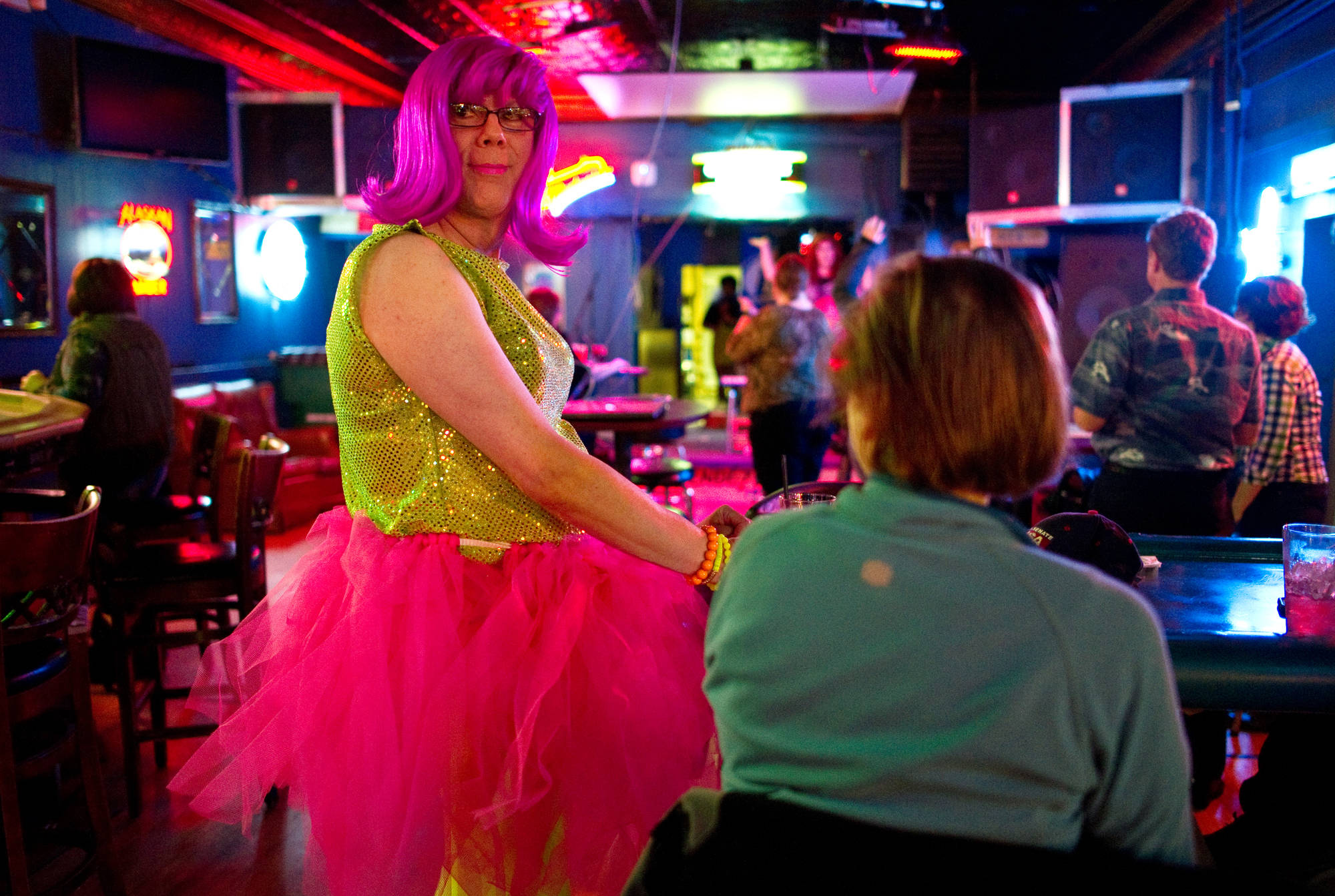 Gingi Vitis visits with bar patrons during Drag Queen Bingo at the Rendezvous in September 2013. (Michael Penn | Juneau Empire File)