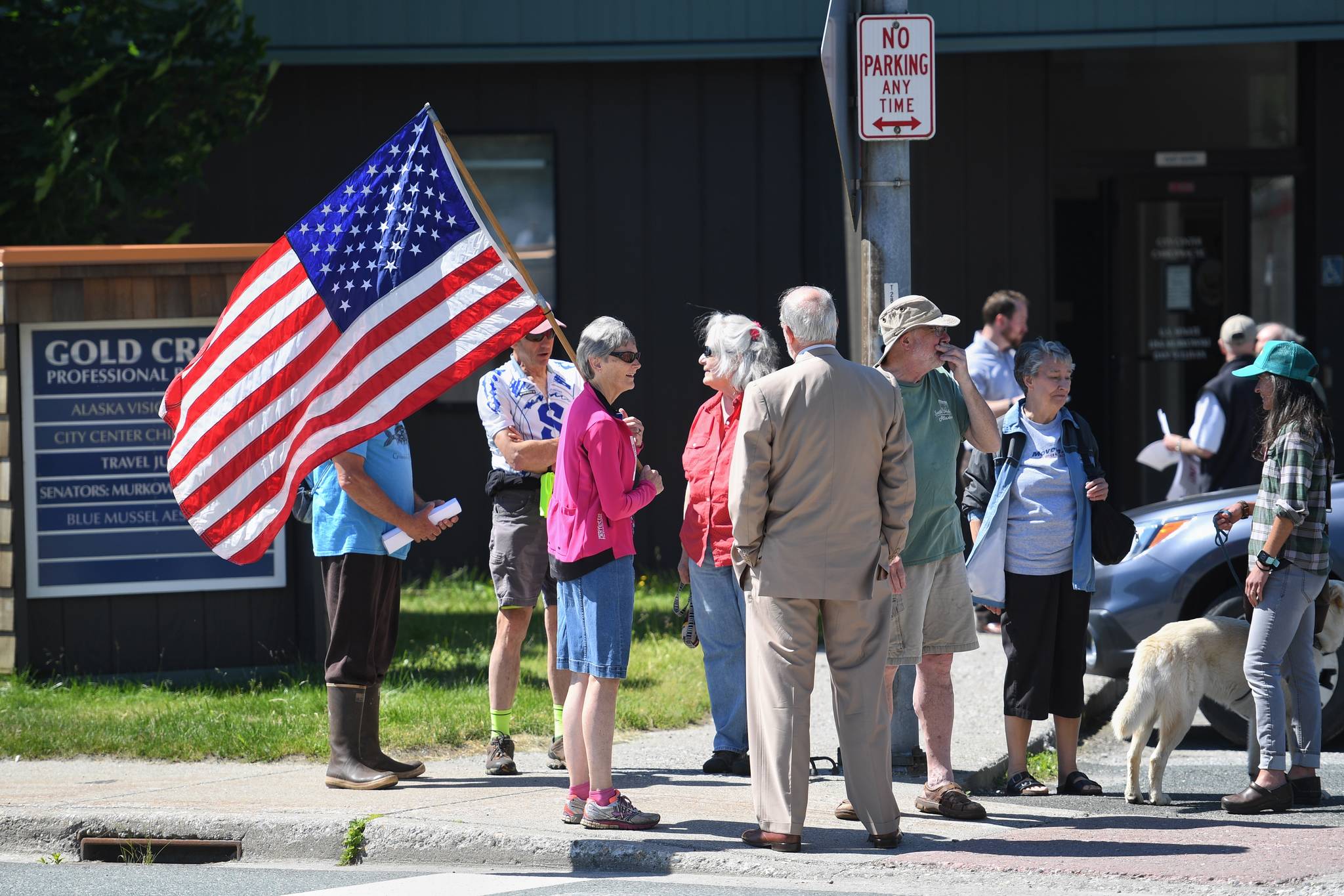 People gather for a rally against the Pebble Mine in front of Sen. Lisa Murkowski’s Juneau office on Tuesday, June 25, 2019. The rally was organized by The Alaska Center, an Anchorage-based environmental organization. (Michael Penn | Juneau Empire)