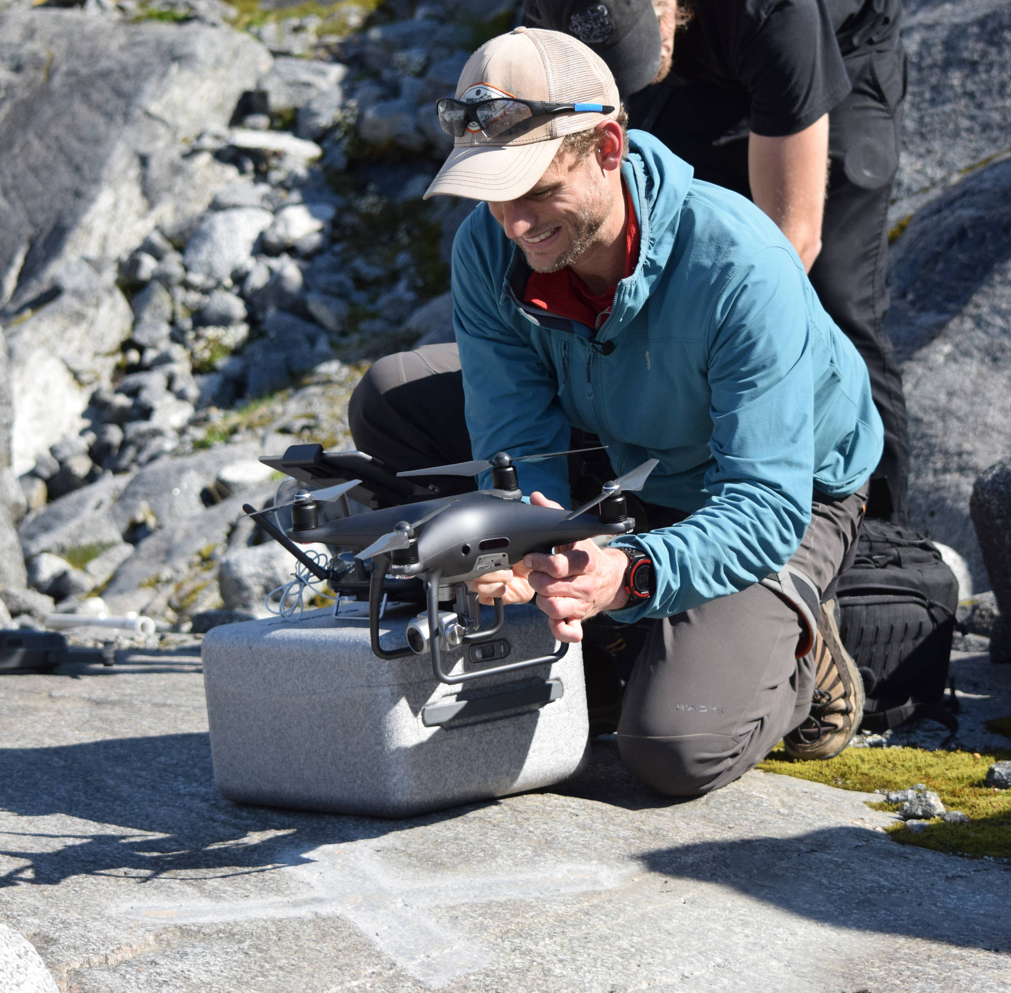 University of Alaska Southeast professor of environmental science Christian Kienholz gets his drone ready for flight on a rock outcrop near Suicide Basin on Friday, June 21, 2019. (Nolin Ainsworth | Juneau Empire)