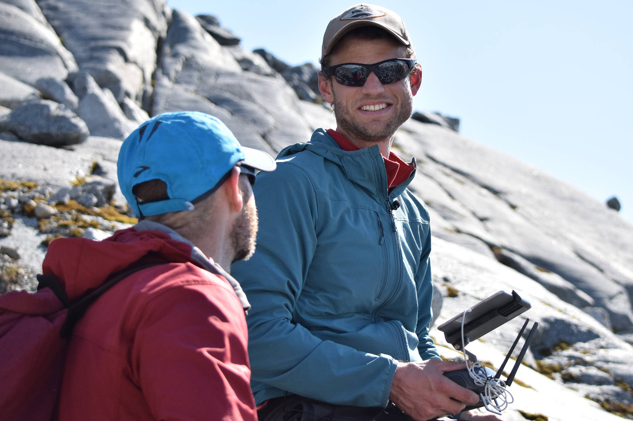 Christian Kienholz, research assistant professor of environmental science at the University of Alaska Southeast, speaks with Gabriel Wolken, research assistant professor at the University of Alaska Fairbanks, while surveying Suicide Basin using a drone on Friday, June 21, 2019. (Nolin Ainsworth | Juneau Empire)