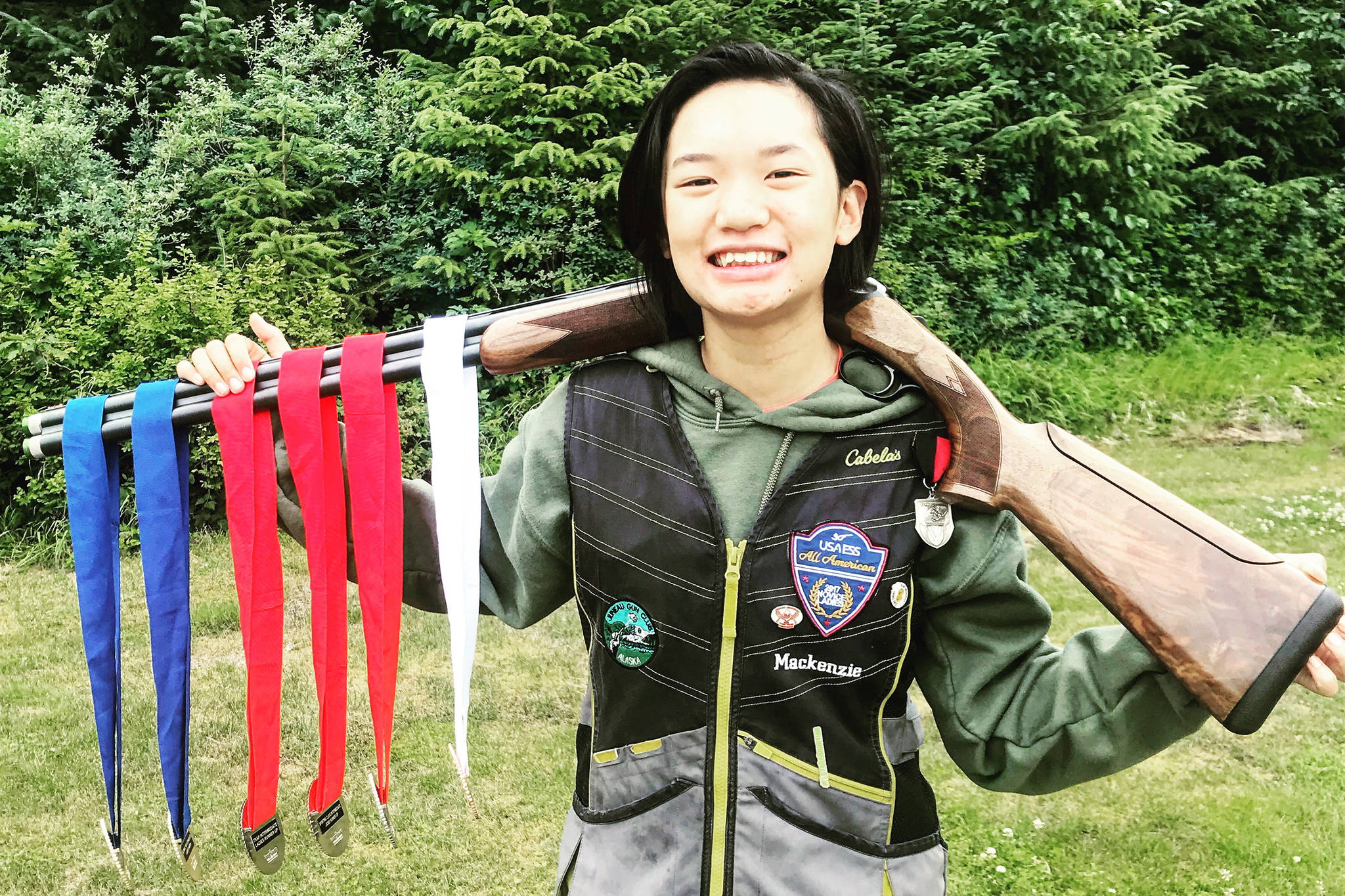 Juneau Trap Team’s Mackenzie Lam poses with the medals she won at the USA YESS National Junior Clay Target Championships in Juneau earlier this week. (Courtesy Photo | Marie Lam)
