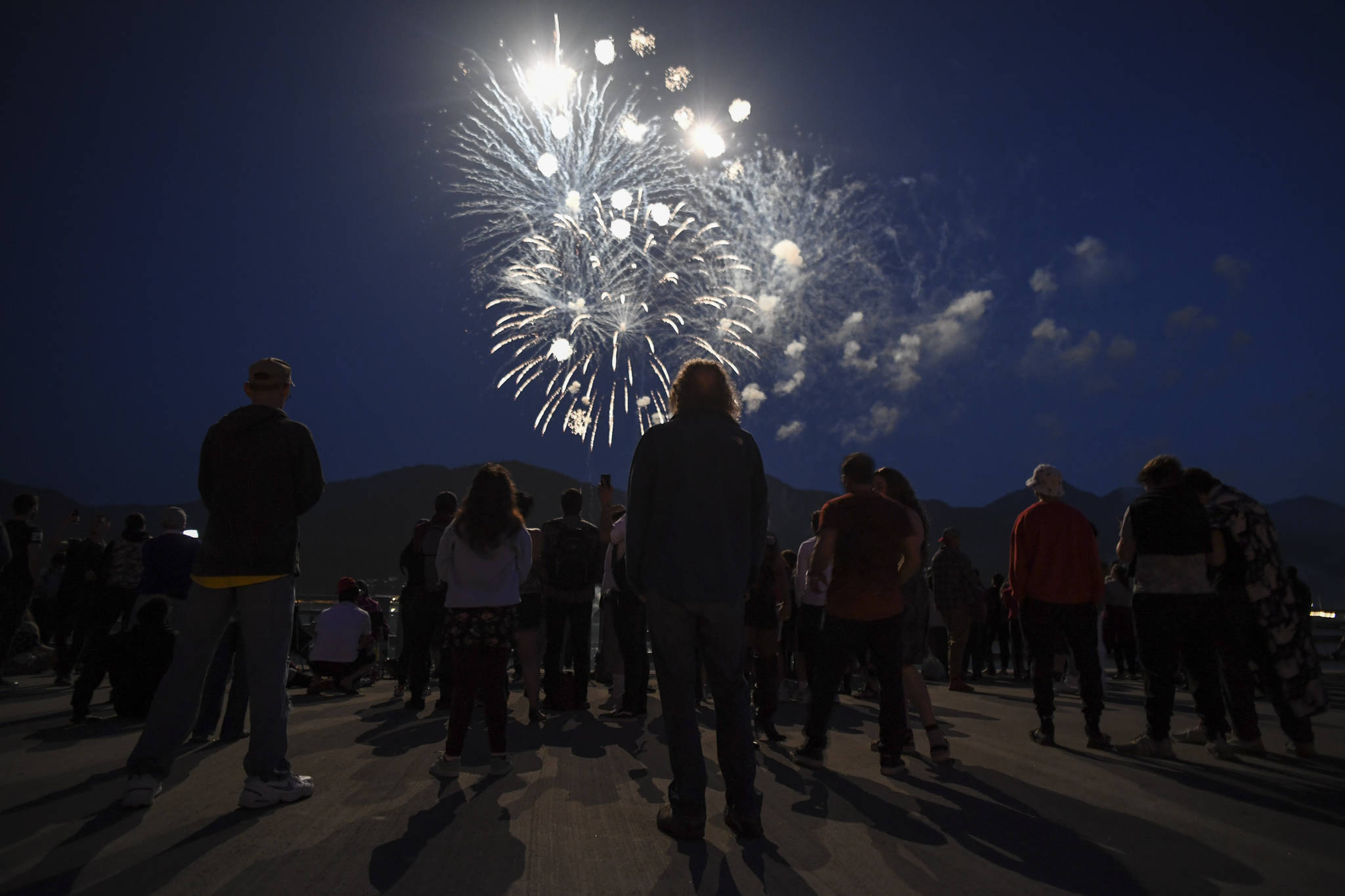 Juneau residents gather around the downtown waterfront to watch the annual fireworks display on Wednesday, July 3, 2019. (Michael Penn | Juneau Empire)