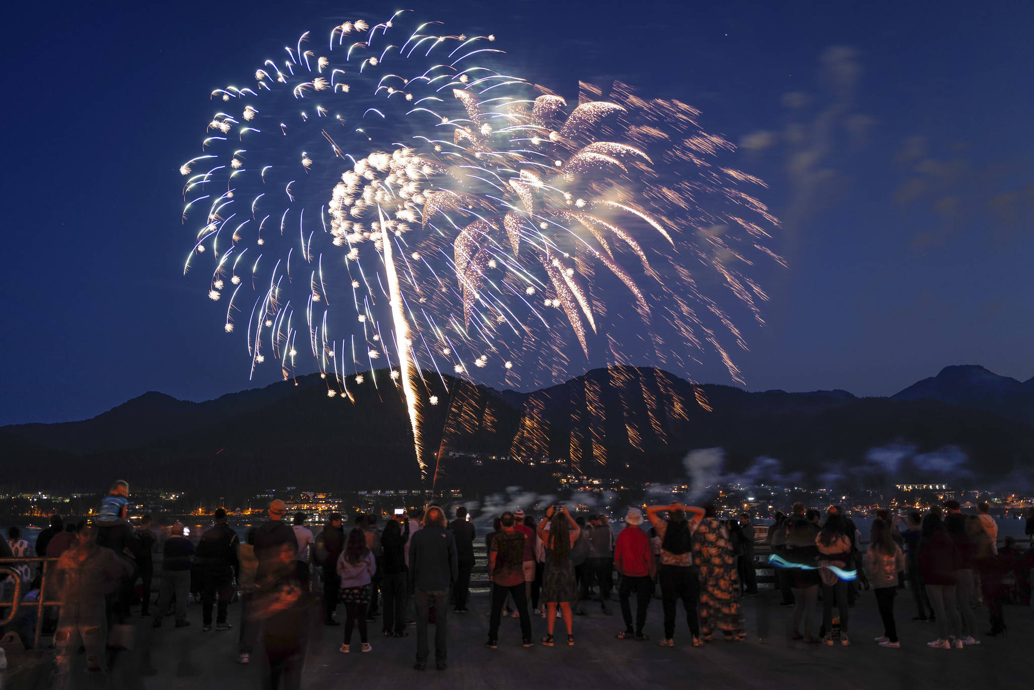Juneau residents gather around the downtown waterfront to watch the annual fireworks display on Wednesday, July 3, 2019. (Michael Penn | Juneau Empire)