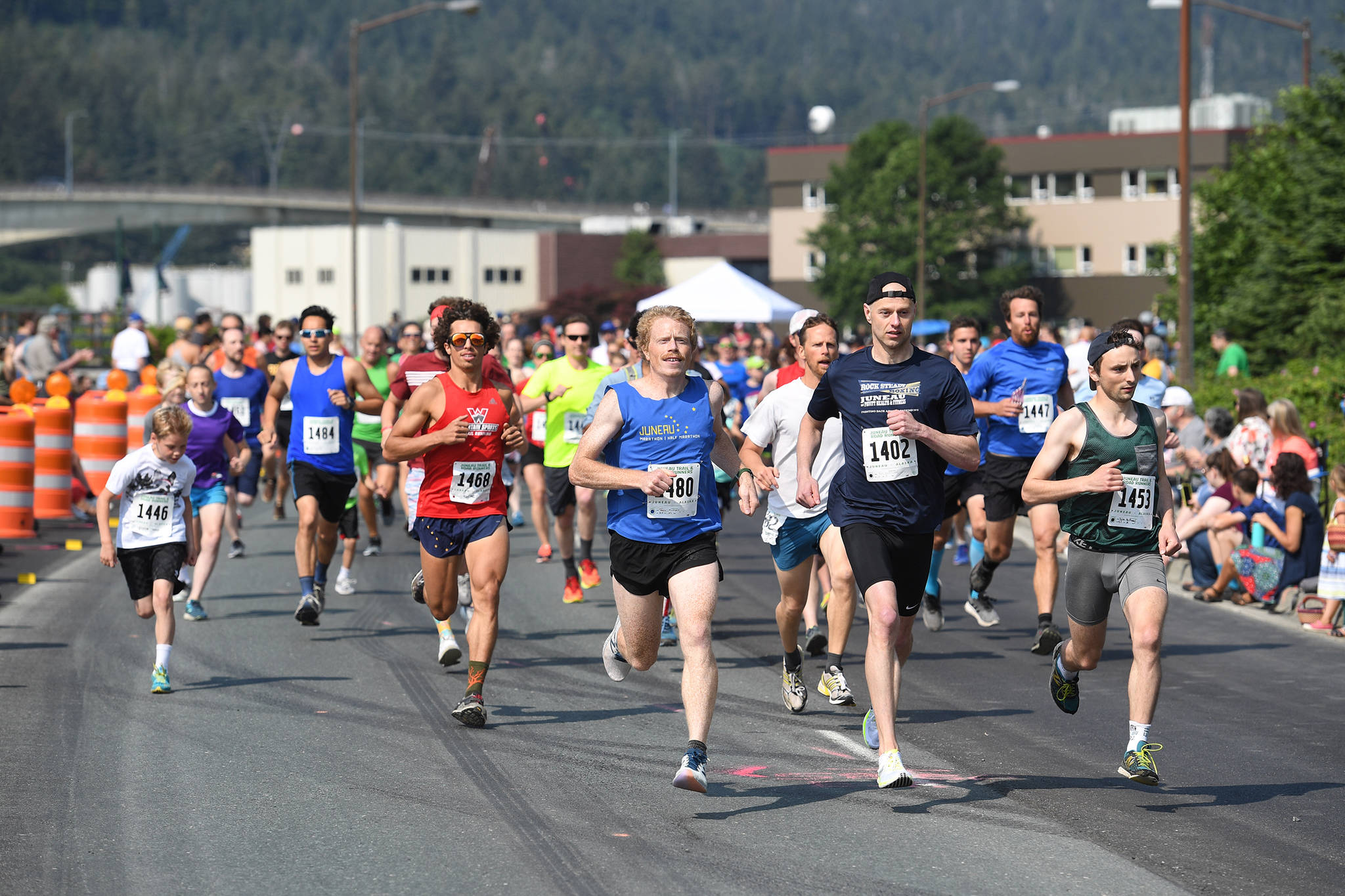 Glenn Frick Memorial Mile participants cruise down Egan Highway in the first half-mile of the race on Thursday, July 4, 2019. (Michael Penn | Juneau Empire)