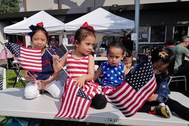 Children get ready for the Fourth of July parade along Egan Drive on Thursday, July 4, 2019. (Michael Penn | Juneau Empire)