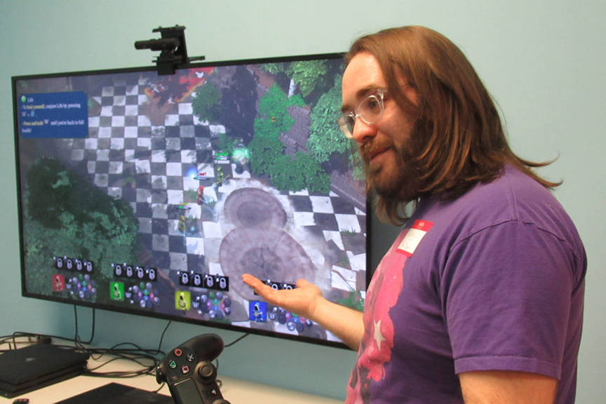 Casey Harris talks gamers through a video game at Game On in February 2019. (Ben Hohenstatt | Juneau Empire File)