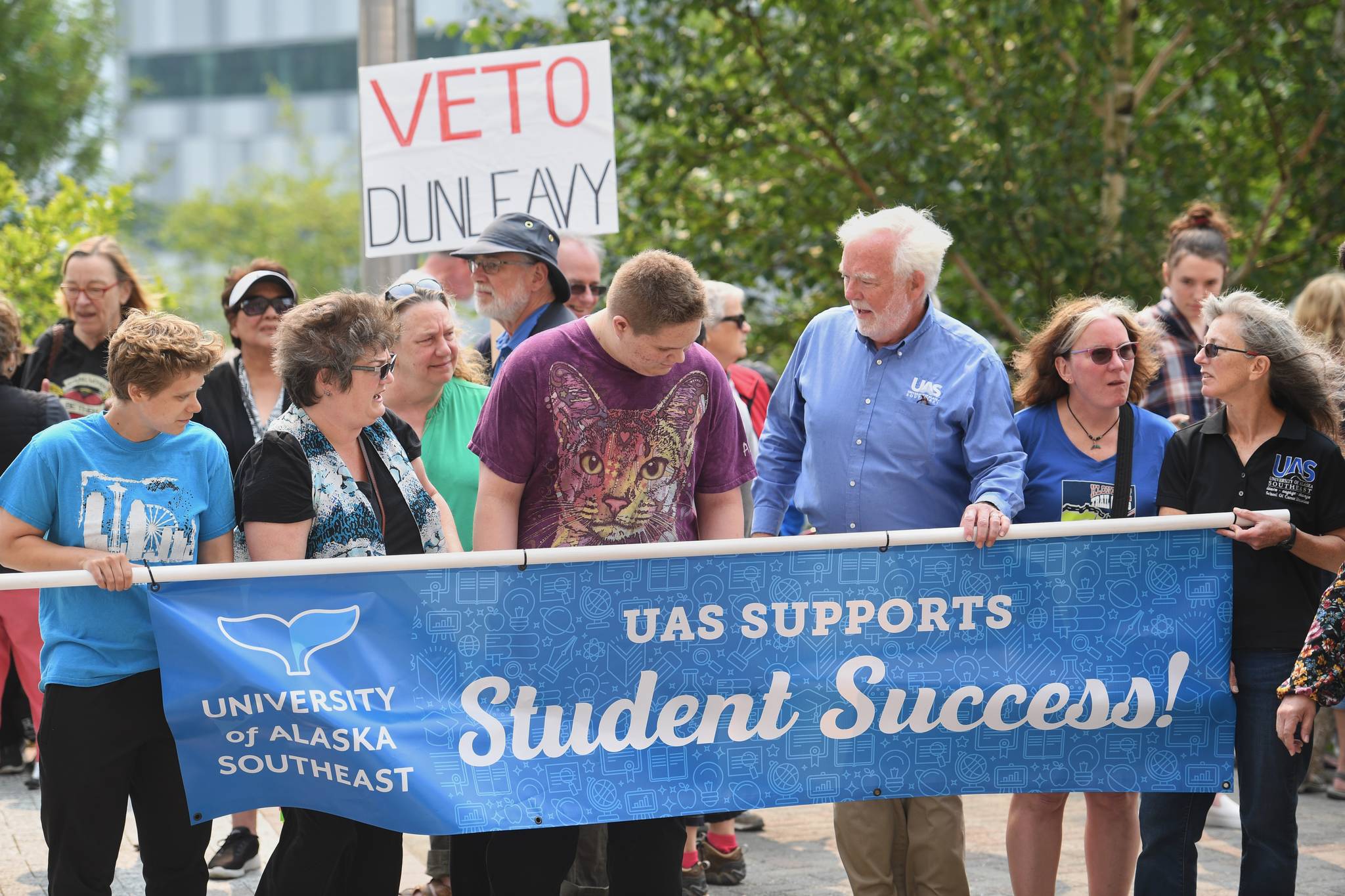 UAS Chancellor Rick Caulfield joins students and others in front of the Capitol calling for for an override of Gov. Mike Dunleavy’s budget vetoes on Monday, July 8, 2019. (Michael Penn | Juneau Empire)