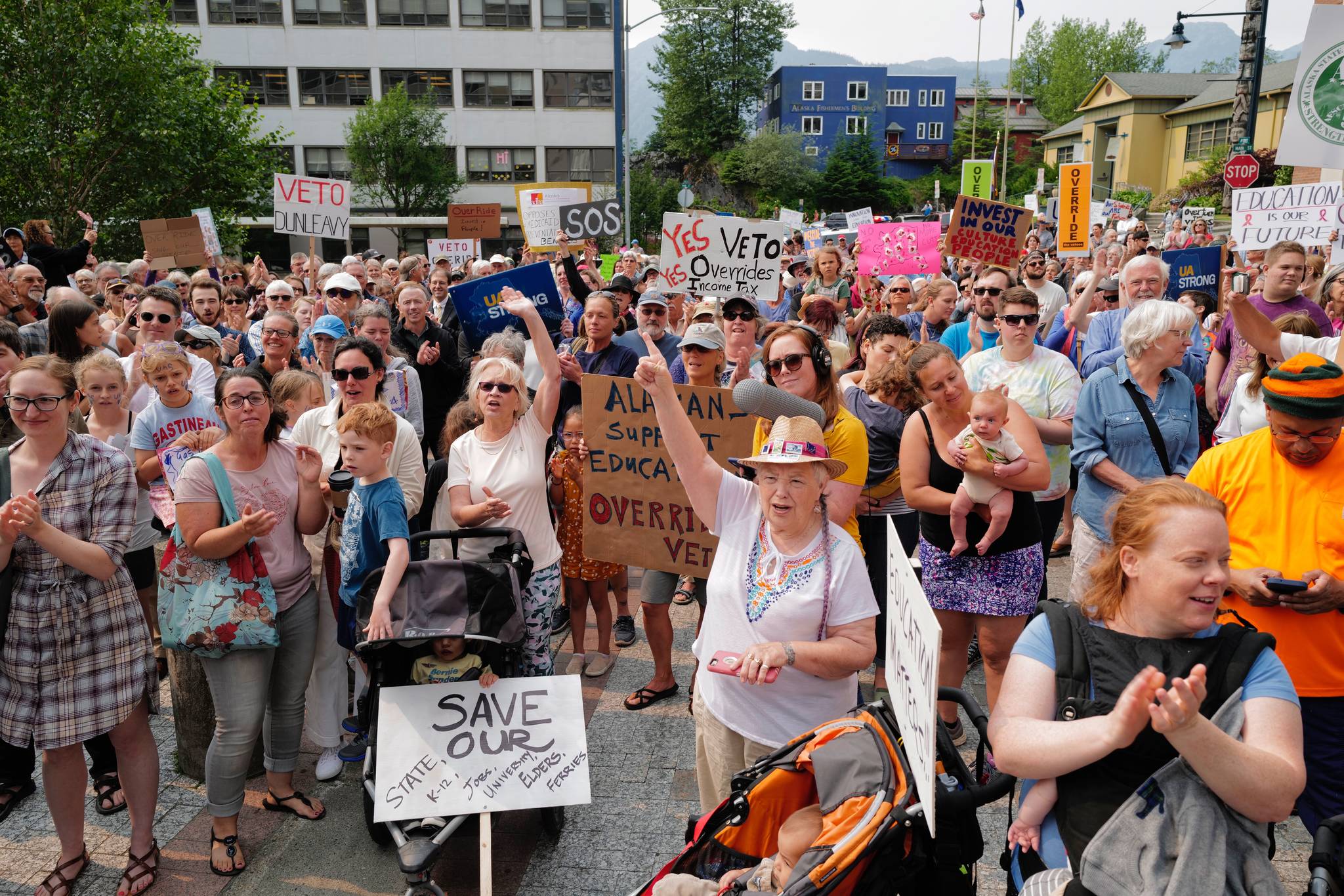 Hundreds of people gather for a rally in front of the Capitol calling for for an override of Gov. Mike Dunleavy’s budget vetoes on Monday, July 8, 2019. (Michael Penn | Juneau Empire)