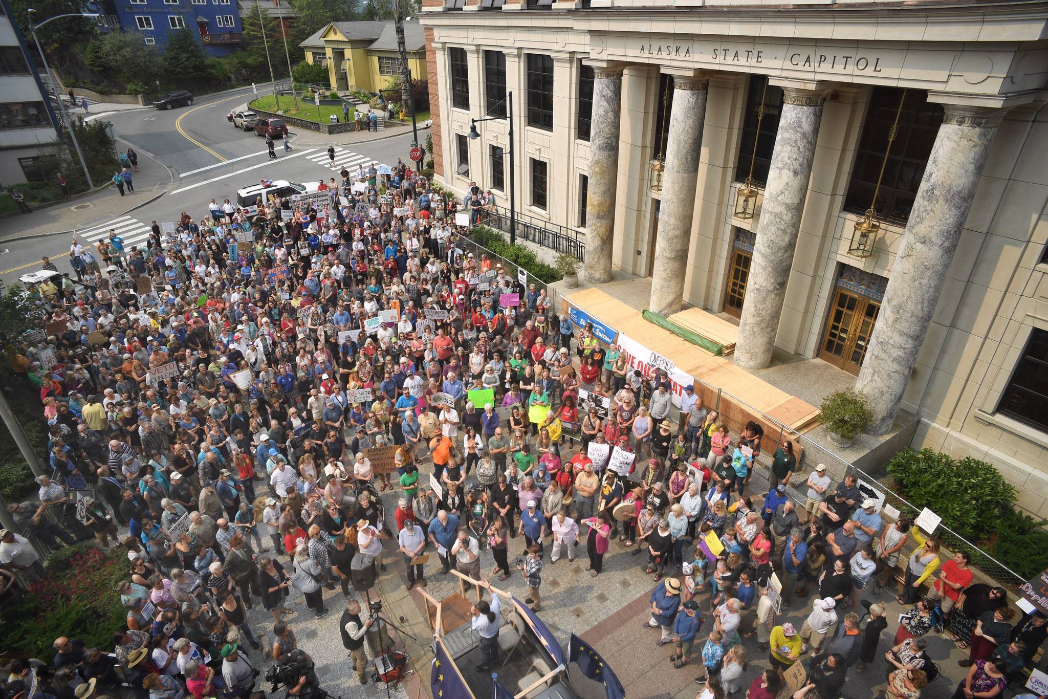 Hundreds attend a rally in front of the Capitol calling for for an override of Gov. Mike Dunleavy’s budget vetoes on Monday, July 8, 2019. (Michael Penn | Juneau Empire)