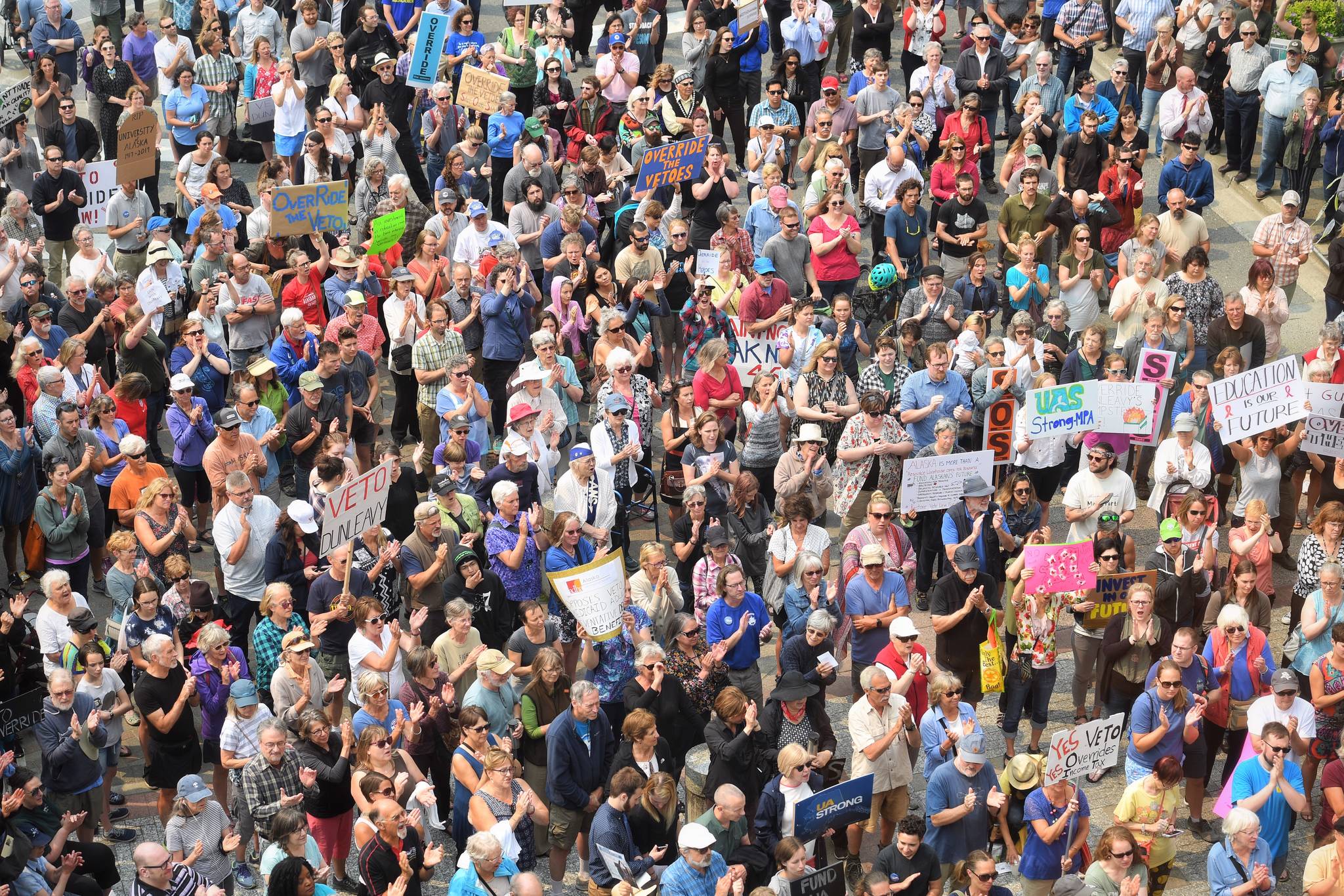 Hundreds attend a rally in front of the Capitol calling for for an override of Gov. Mike Dunleavy’s budget vetoes on Monday, July 8, 2019. (Michael Penn | Juneau Empire)