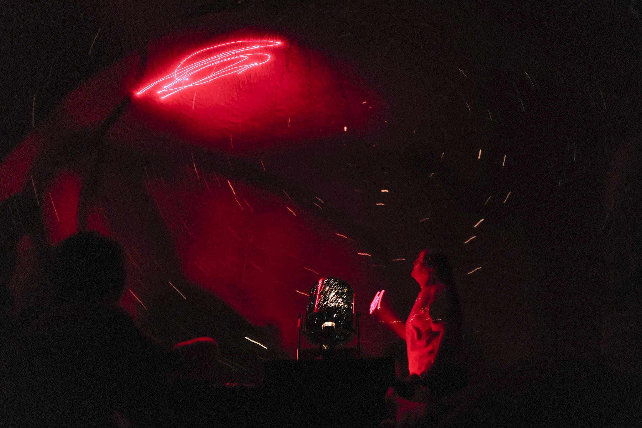 Rosemary Walling, a board member of the Marie Drake Planetarium, gives a presentation on the night sky inside a portable planetarium at the Alaska State Museum on Friday, July 5, 2019. (Michael Penn | Juneau Empire)