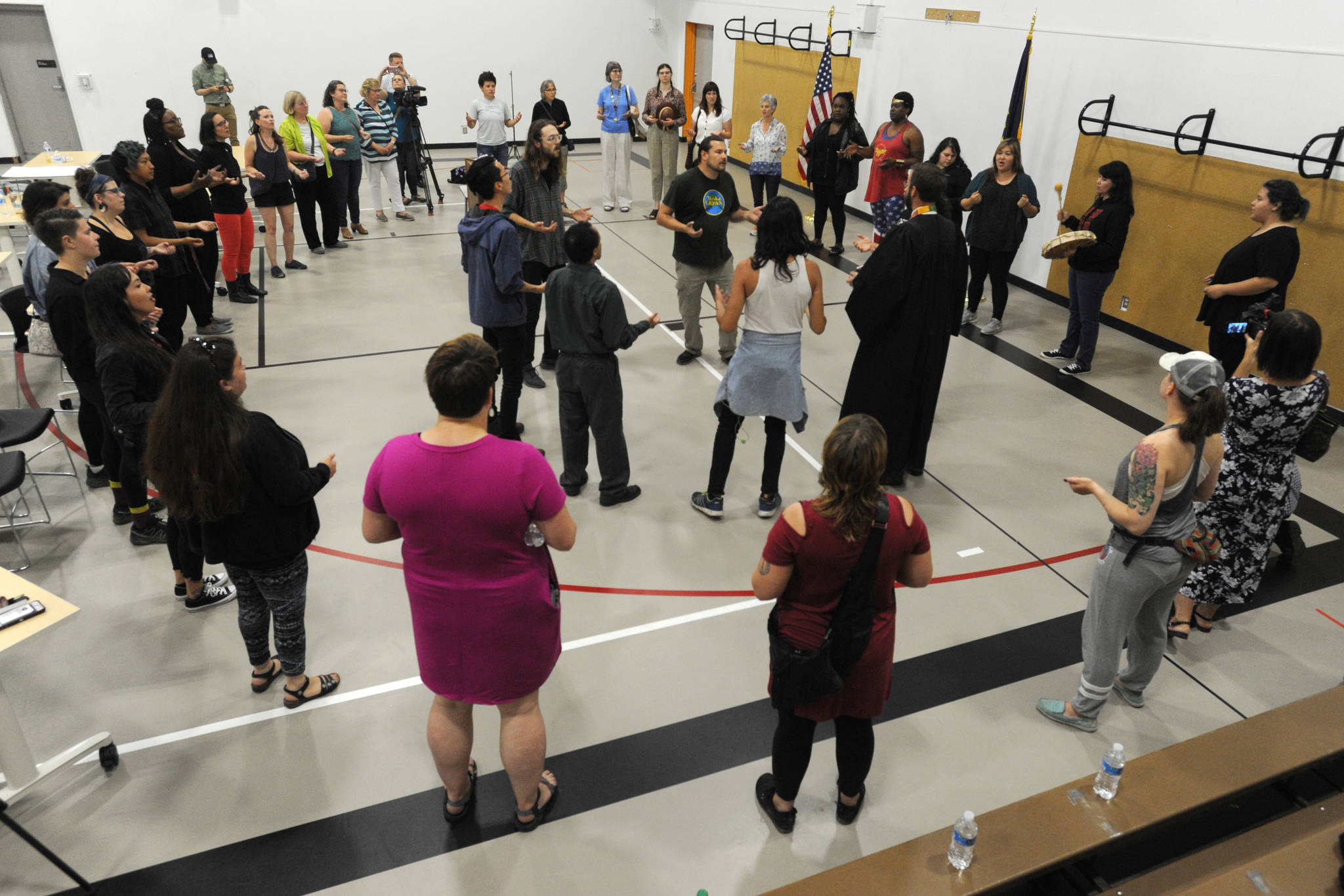 Protesters sang an exit song after hijacking the legislative special session at Wasilla Middle School on Wednesday, July 10, 2019. (Bill Roth / ADN)