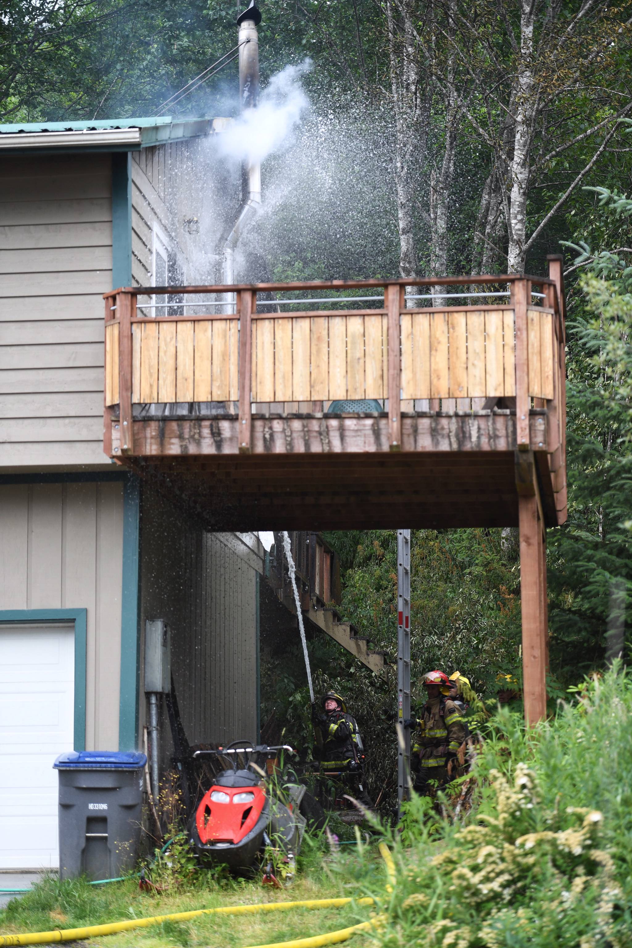 Capital City Fire/Rescue responds to a house fire at 2999 Foster Avenue on Thursday, July 11, 2019. (Michael Penn| Juneau Empire)