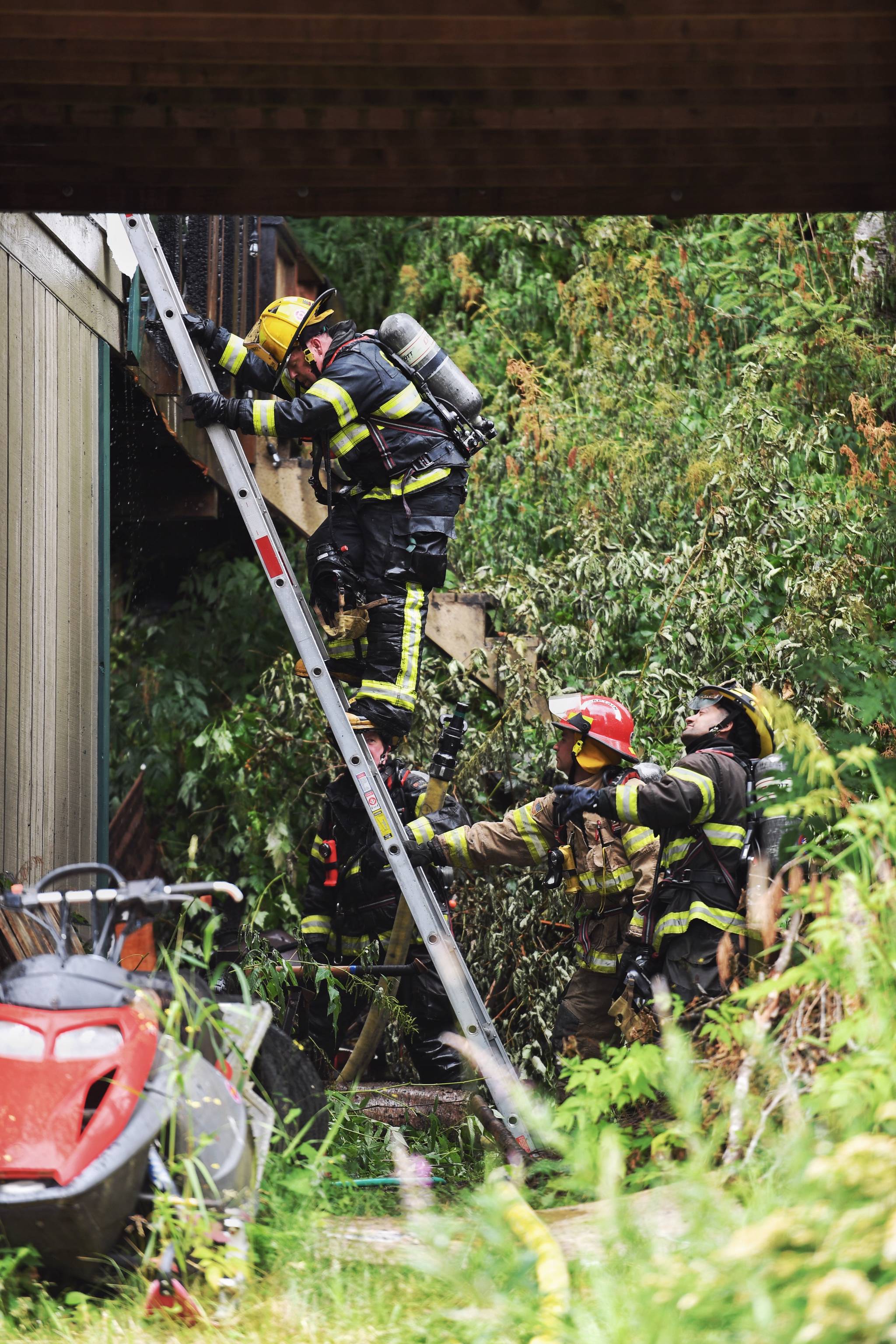 Capital City Fire/Rescue responds to a house fire at 2999 Foster Avenue on Thursday, July 11, 2019. (Michael Penn| Juneau Empire)