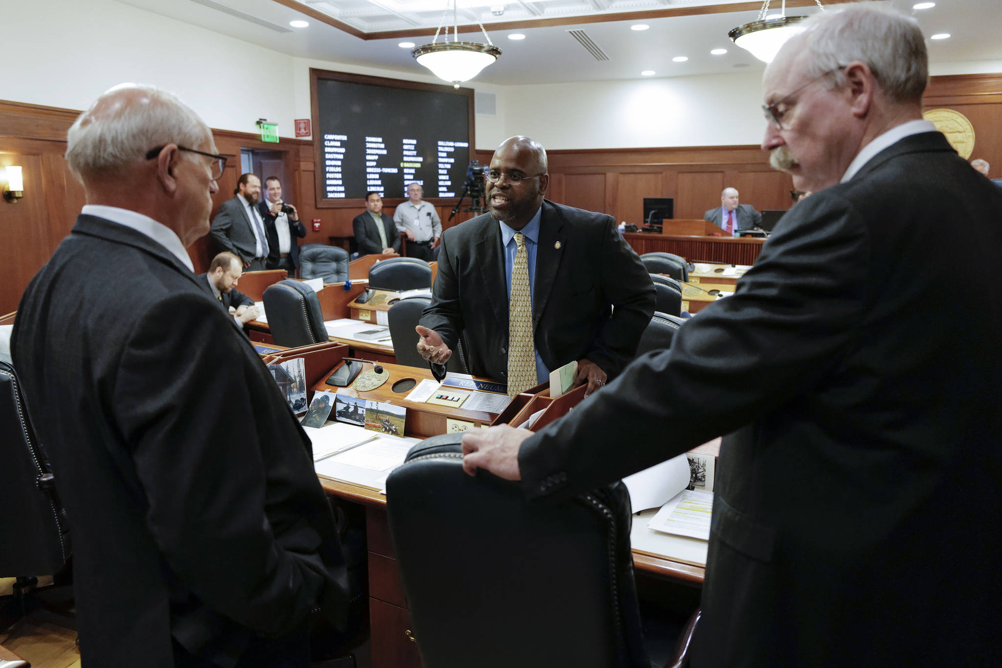 Sen. David Wilson, R-Wasilla, center, has a heated discussion with Sen. John Coghill, North Pole, left, as Sen. Bert Stedman, R-Sitka, listens before a Joint Session of Alaska Legislature at the Capitol on Thursday, July 11, 2019, to debate and vote on an override of Gov. Mike Dunleavy’s budget vetoes. The vote didn’t take place because not enough legislators attended. (Michael Penn | Juneau Empire)