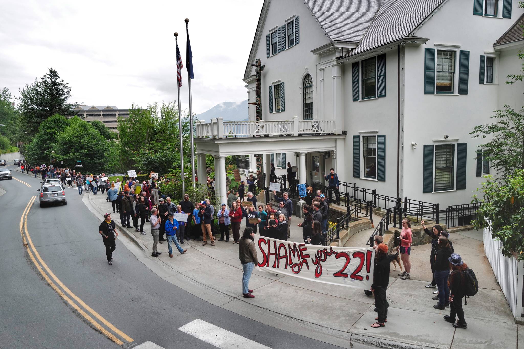 People attend a rally against Gov. Mike Dunleavy’s budget vetoes in front of the Capitol on Friday, July 12, 2019. (Michael Penn | Juneau Empire)