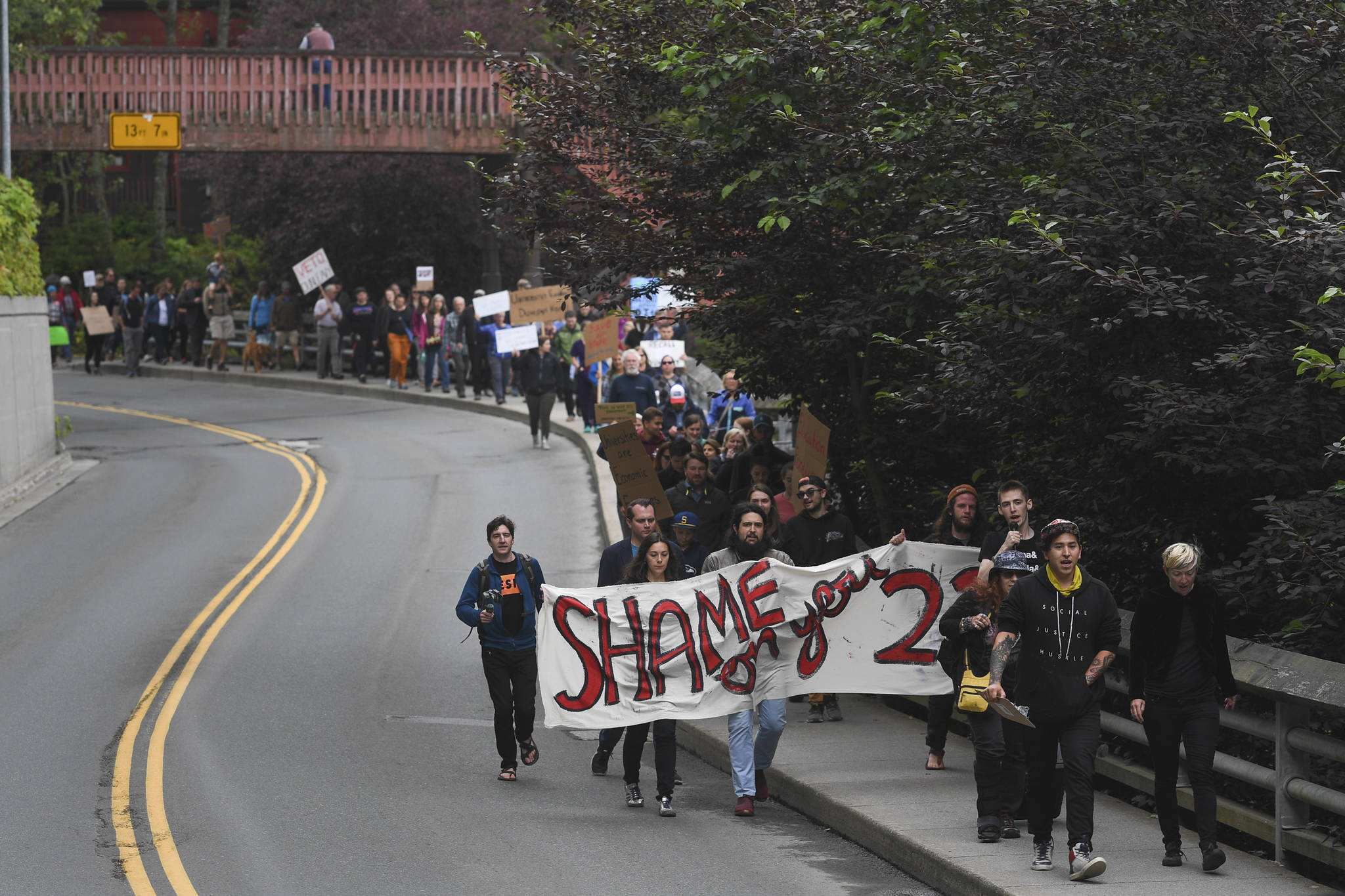 Over hundred people gather in front of the Governor’s Mansion to protest budget vetoes by Gov. Mike Dunleavy on Friday, July 12, 2019. (Michael Penn | Juneau Empire)