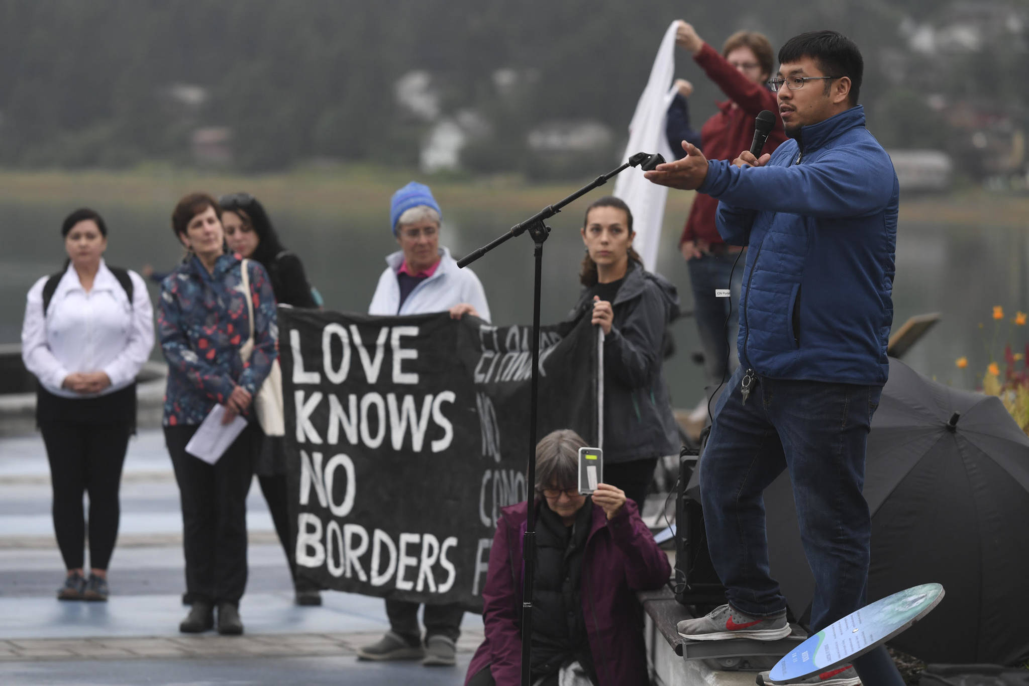 Speakers in Juneau host a rally denouncing immigrant detention facilities Friday, July 12, 2019. (Michael Penn | Juneau Empire)