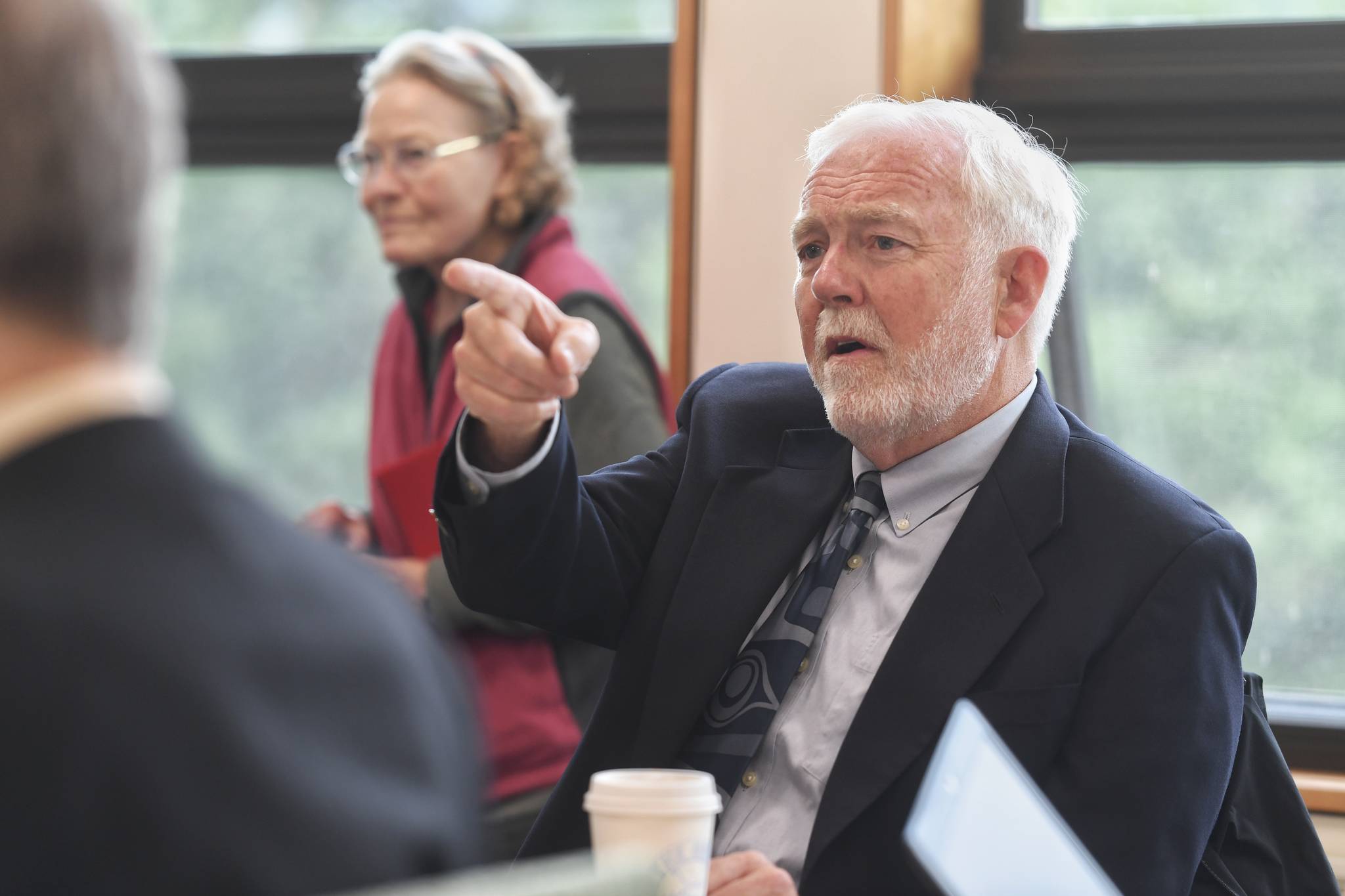 Dr. Richard Caulfield, Chancellor at the University of Alaska Southeast, watches an online meeting being held at UA campuses around the state on Gov. Mike Dunleavy’s budget cuts on Monday, July 15, 2019. (Michael Penn | Juneau Empire)