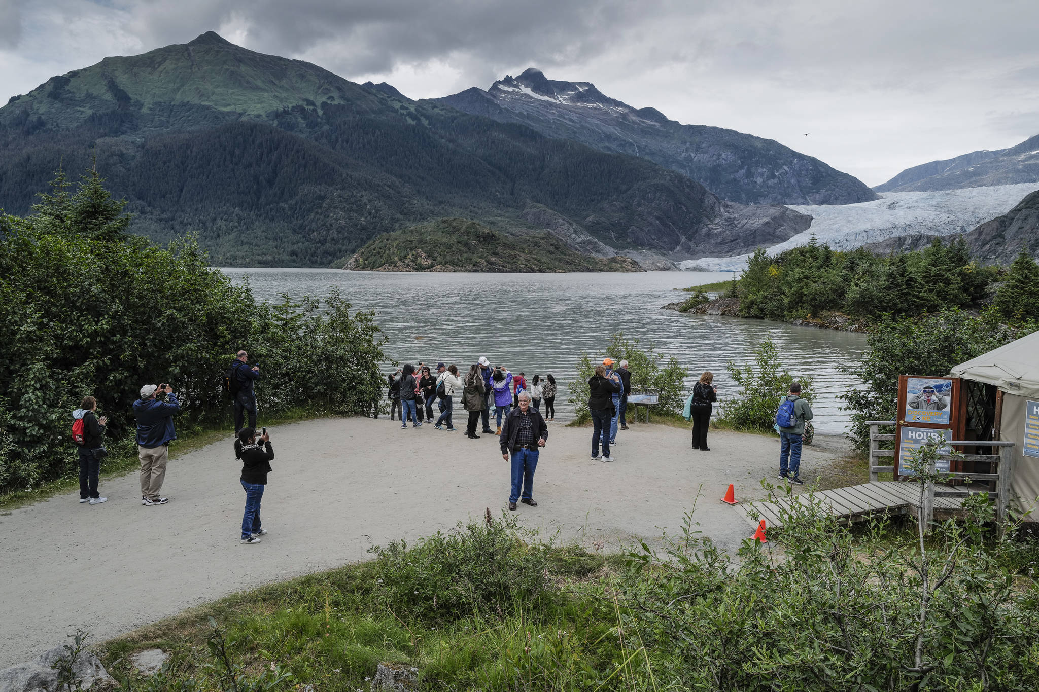 Visitors at Mendenhall Lake on Monday, July 15, 2019. A glacial lake outburst flood from Suicide Basin released into Mendenhall Lake last week and peaked Sunday night. (Michael Penn | Juneau Empire)