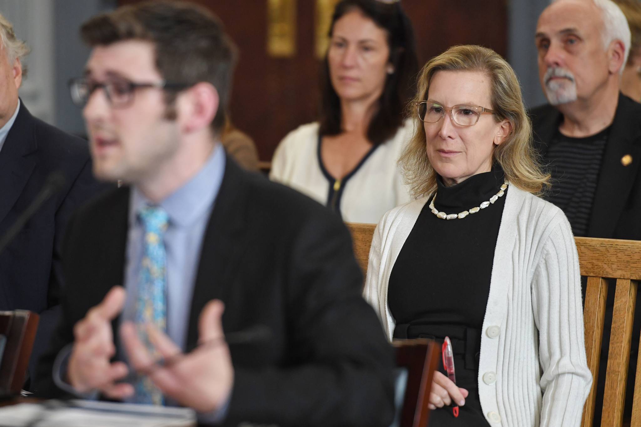 Donna Arduin, Director of the Office of Management and Budget, right, watches as Neil Steininger, administrative services director for OMB, explains how the office performs “sweeps” of unspent money in various government accounts during a Senate Finance meeting at the Capitol on Thursday, July 18, 2019.(Michael Penn | Juneau Empire)