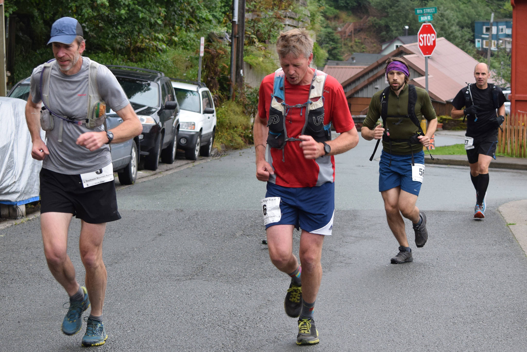 Franz Mueter, left and Alex Andrews lead a group of runners up Basin Road at the start of the Juneau Ridge Race on Saturday, July 20, 2019. Over 60 runners participated in the 15-mile mountain running race that featured approximately 5,000 feet of elevation gain. (Nolin Ainsworth | Juneau Empire)