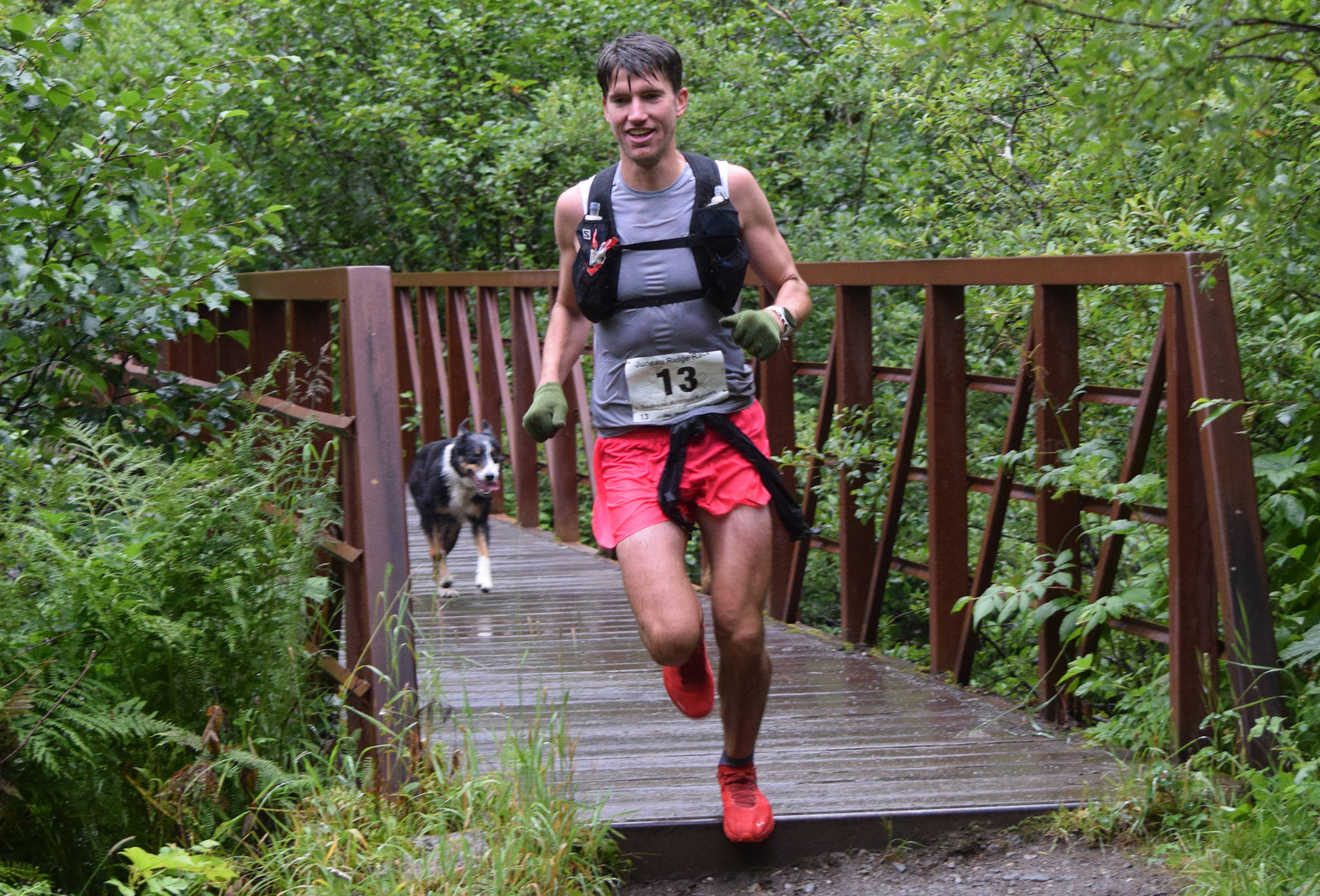 Allan Spangler runs across Gold Creek on Perseverance Trail while competing in the Juneau Ridge Race at Cope Park on Saturday, July 20, 2019. Over 60 runners participated in the 15-mile mountain running race that featured approximately 5,000 feet of elevation gain. (Nolin Ainsworth | Juneau Empire)