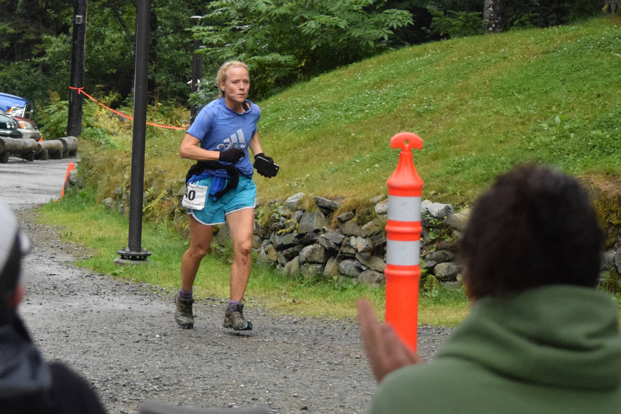 Barbara Baysinger completes the Juneau Ridge Race at Cope Park on Saturday, July 20, 2019. Over 60 runners participated in the 15-mile mountain running race that featured approximately 5,000 feet of elevation gain, including around 20 women. (Nolin Ainsworth | Juneau Empire)