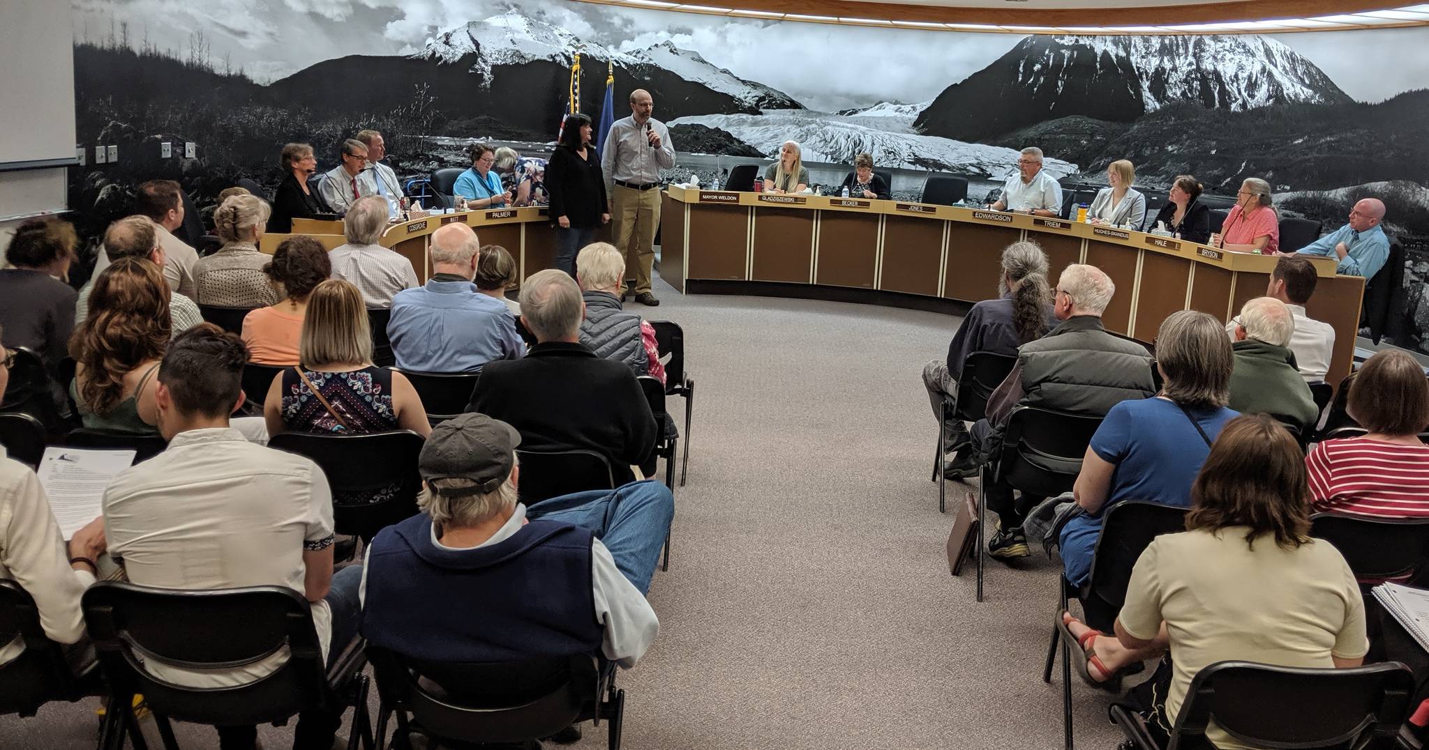 The room is fuller than normal with a blend of folks curious about the proposed New JACC and Centennial Hall projects, onsite marijuana consumption and an assisted senior living development tax abatement among other things on a long agenda. (Ben Hohenstatt | Juneau Empire)