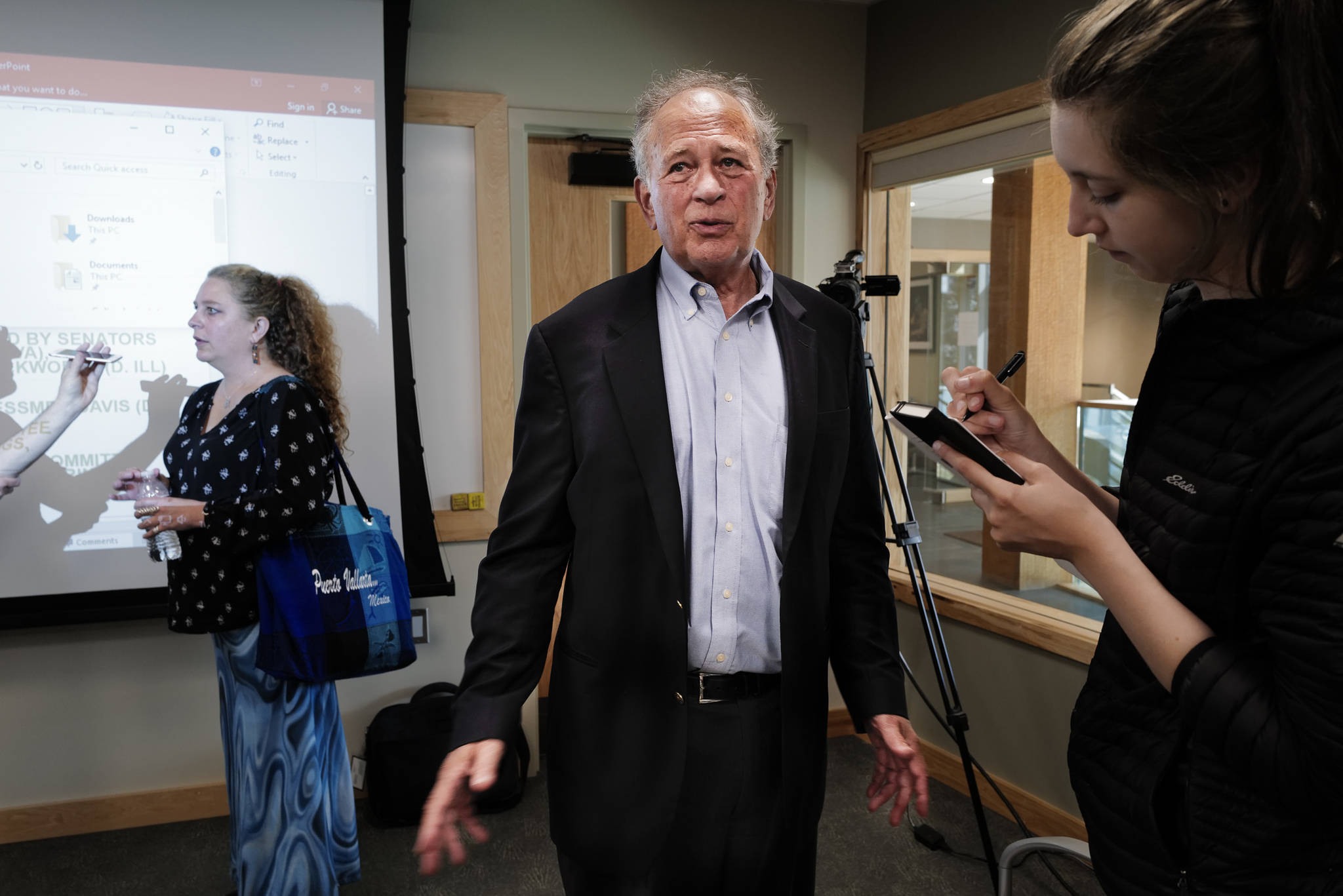 Dan Press, of Van Ness Feldman LLP in Washington, D.C., center, and Brenda Thayer, a mental health counselor for SEARHC, left, answer questions after giving speeches about trauma in Native communities at the Walter Soboleff Center on Tuesday, July 23, 2019. (Michael Penn | Juneau Empire)