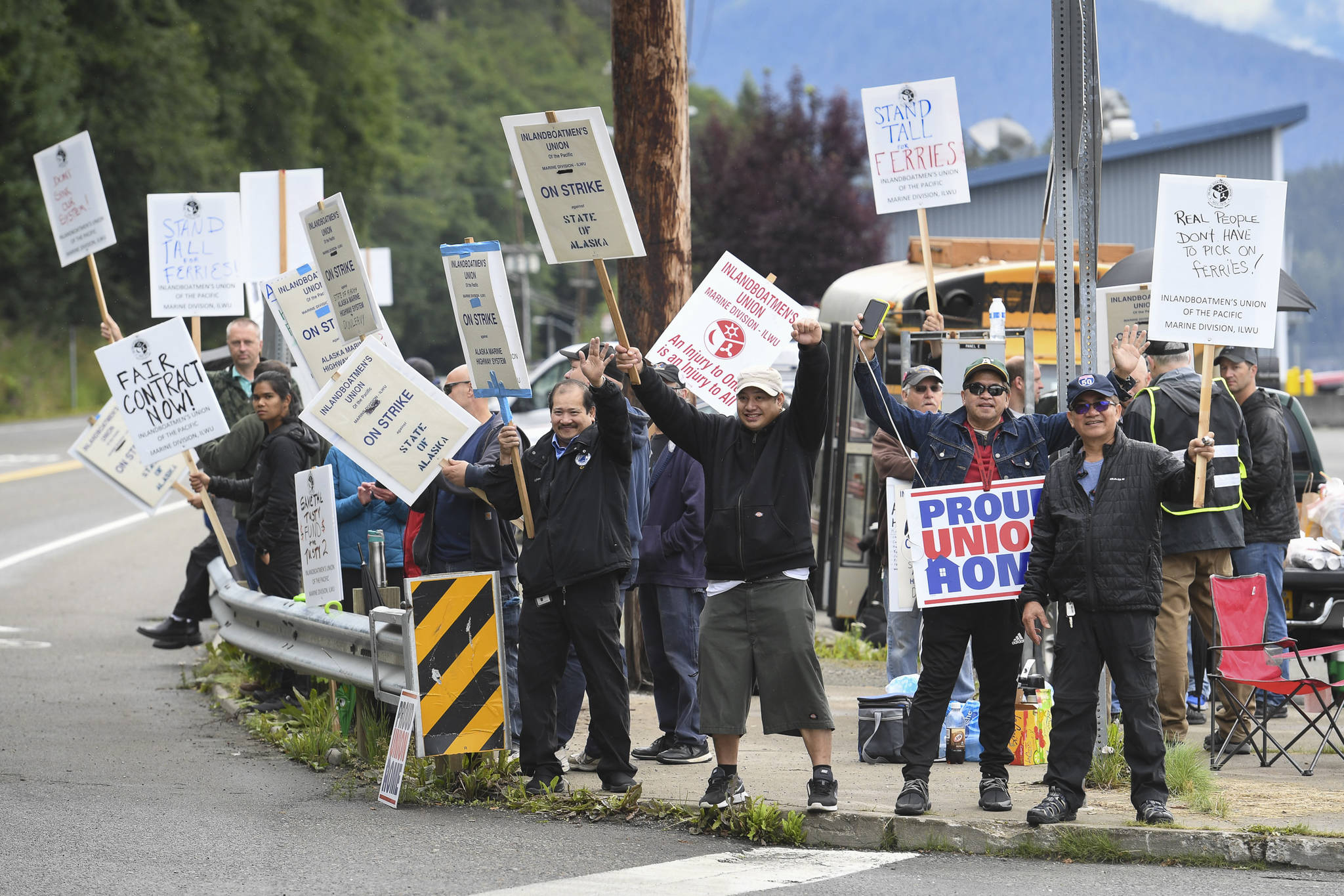 Members of the Inland Boatmen’s Union of the Pacific picket in front of the Auke Bay Terminal on Thursday, July 25, 2019. The union called a strike on Wednesday over failed negotiations with Gov. Mike Dunleavy’s administration. (Michael Penn | Juneau Empire)